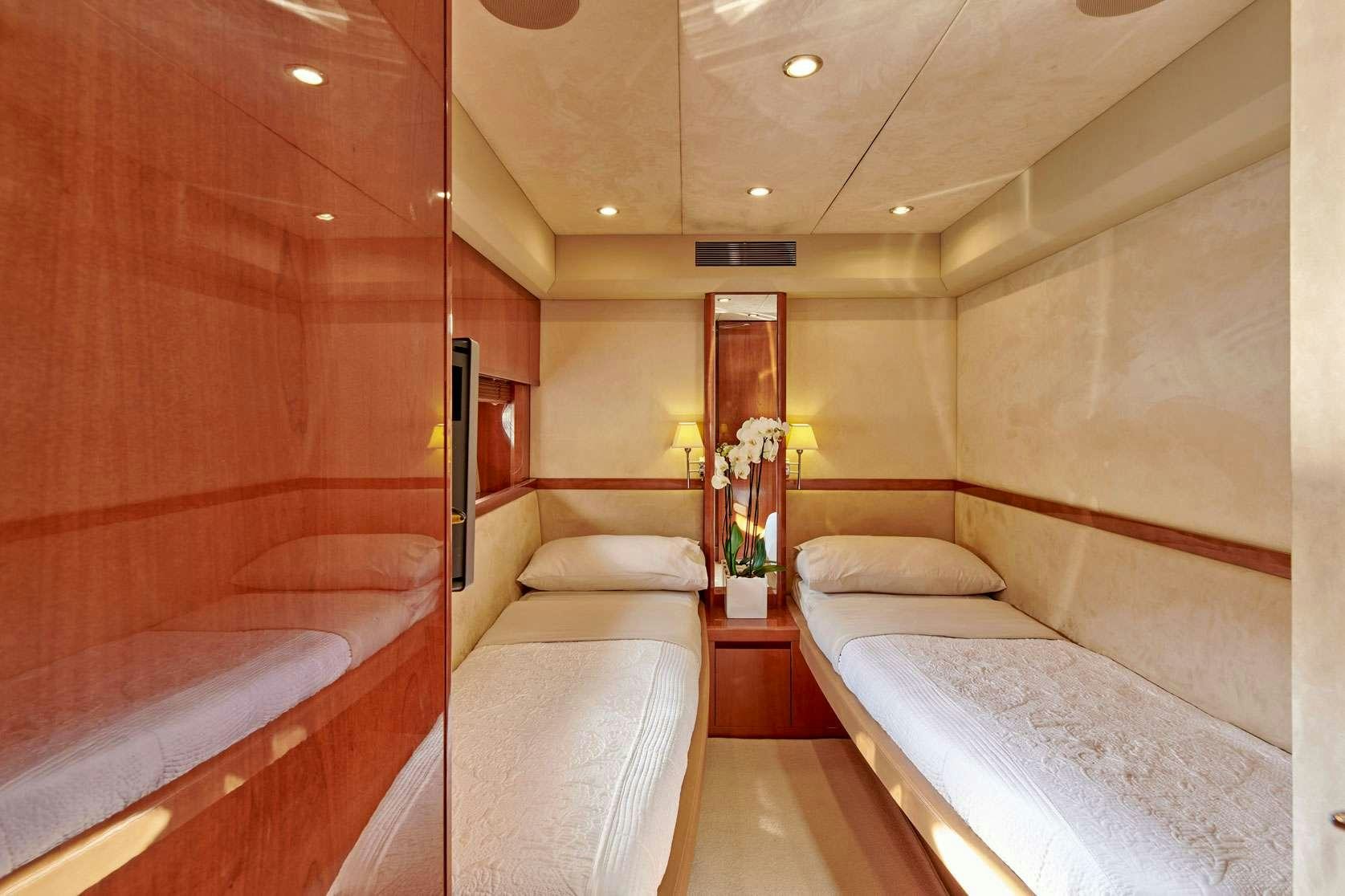 a room with two beds aboard ESTIA ONE Yacht for Charter