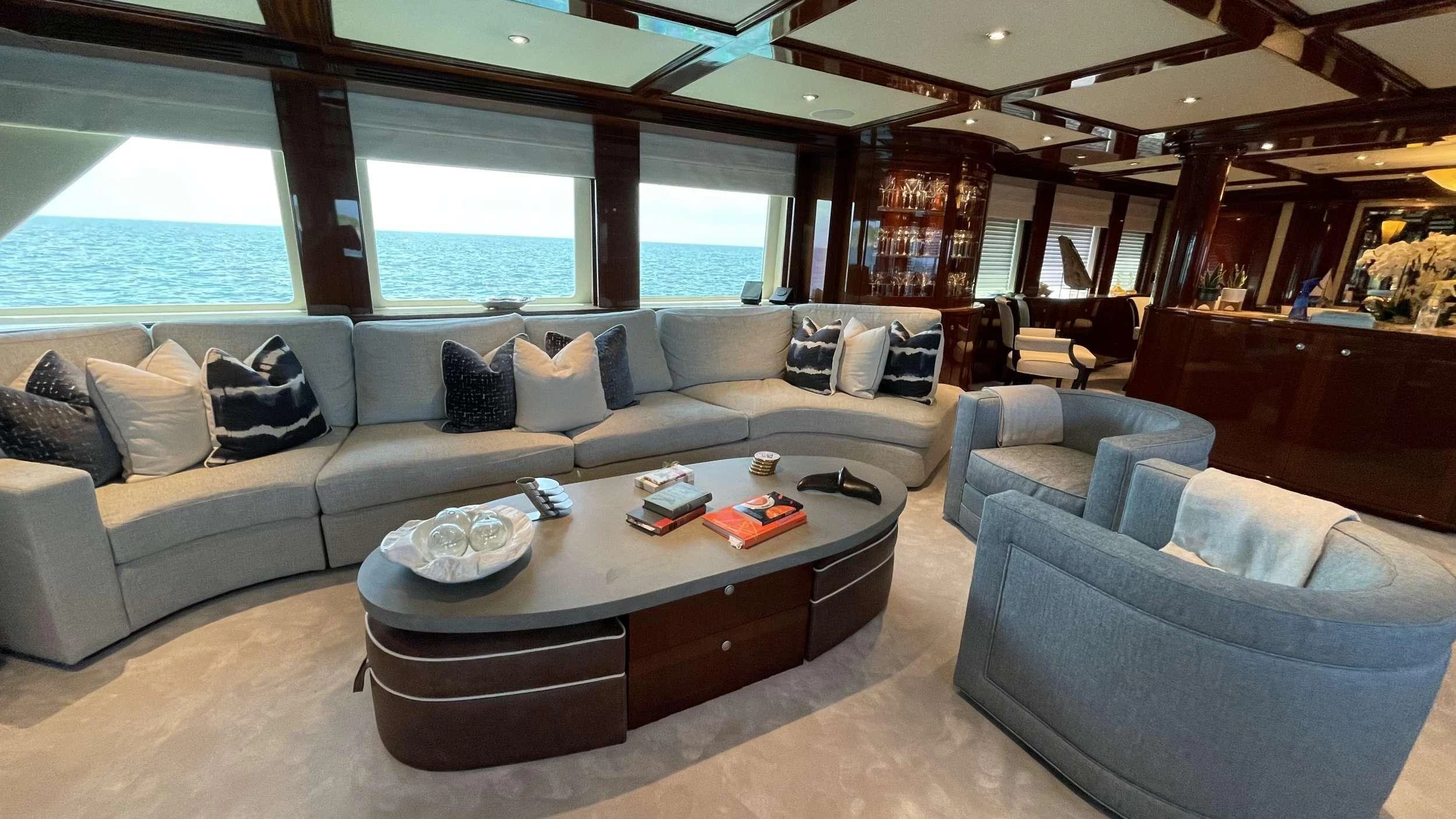 a living room with a large window aboard KASHMIR Yacht for Charter
