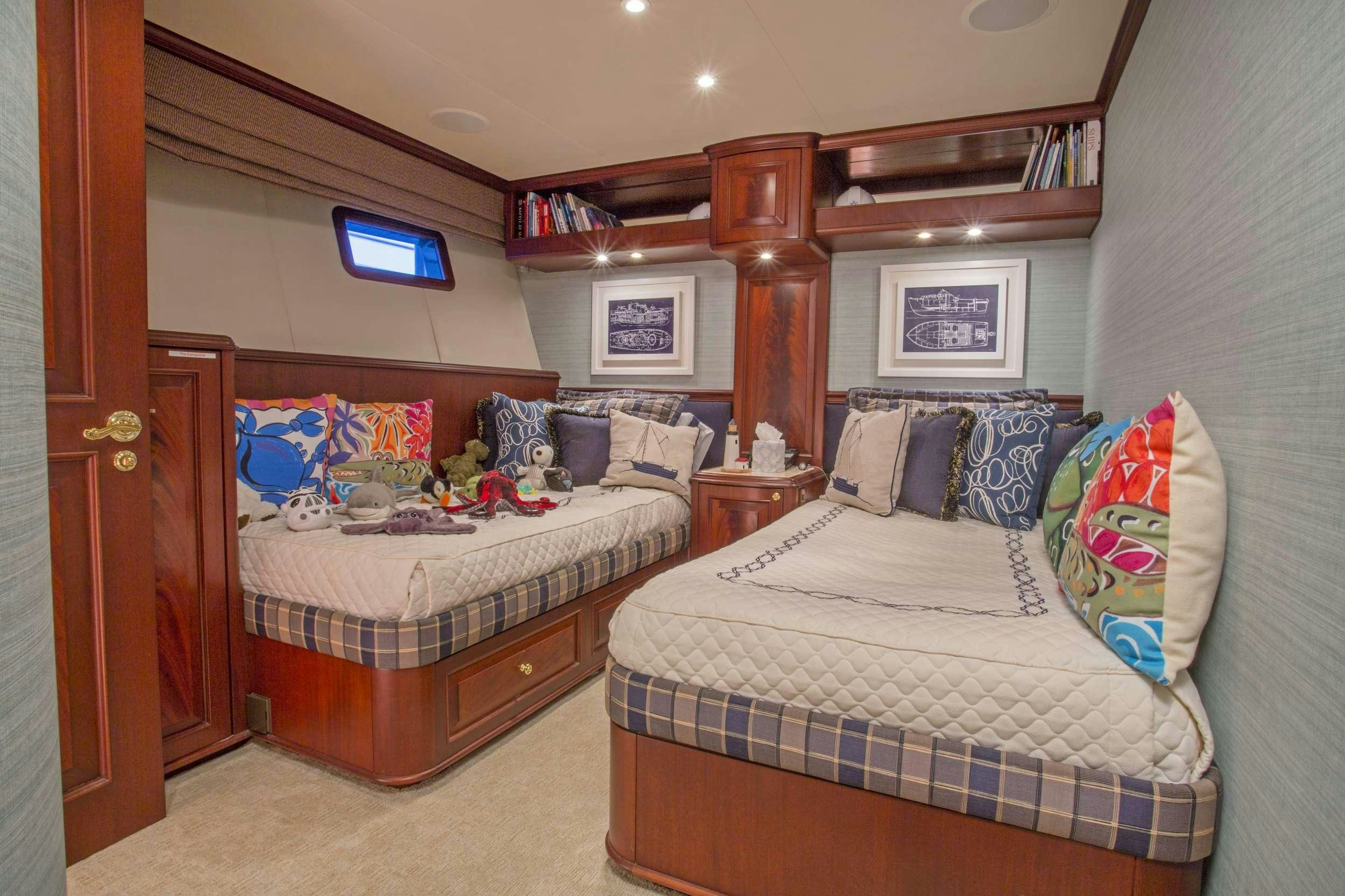 a couple of beds in a room aboard STARLIGHT Yacht for Charter