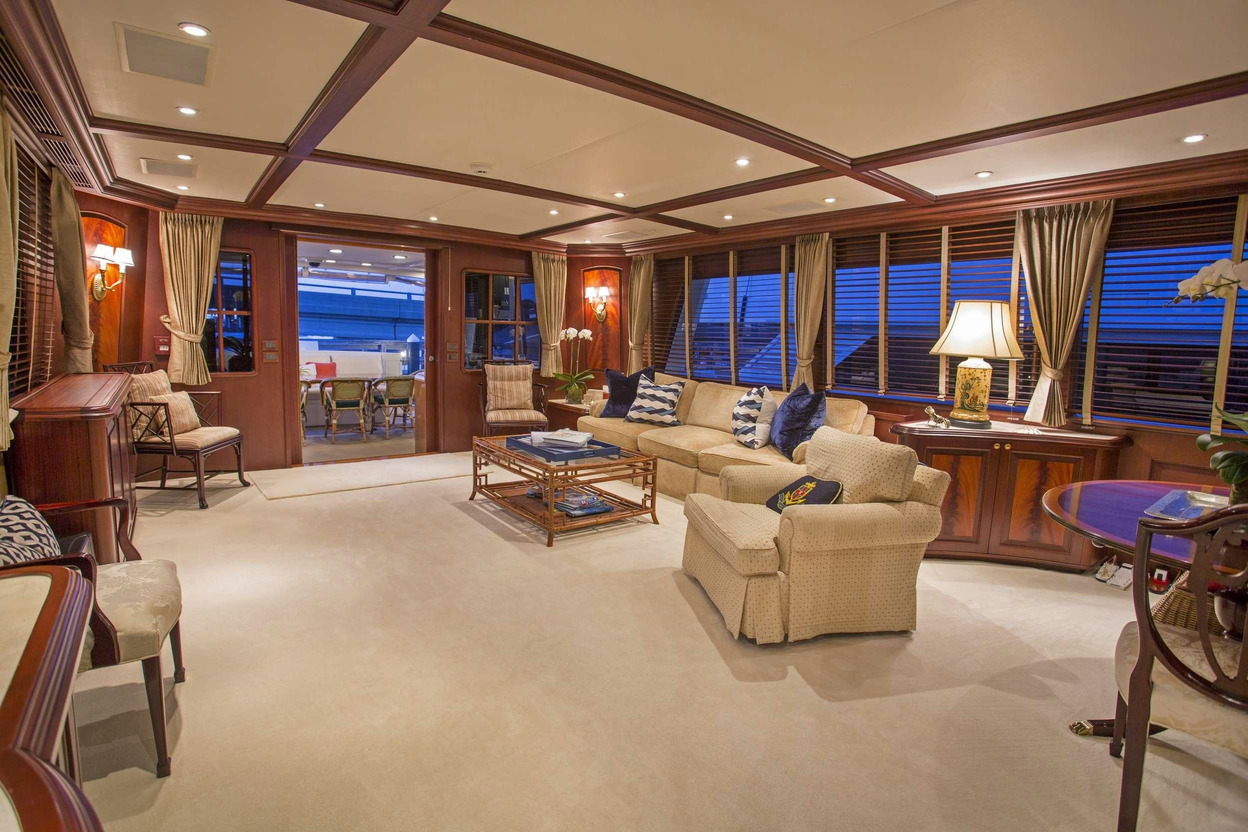 a living room with a large window aboard STARLIGHT Yacht for Charter