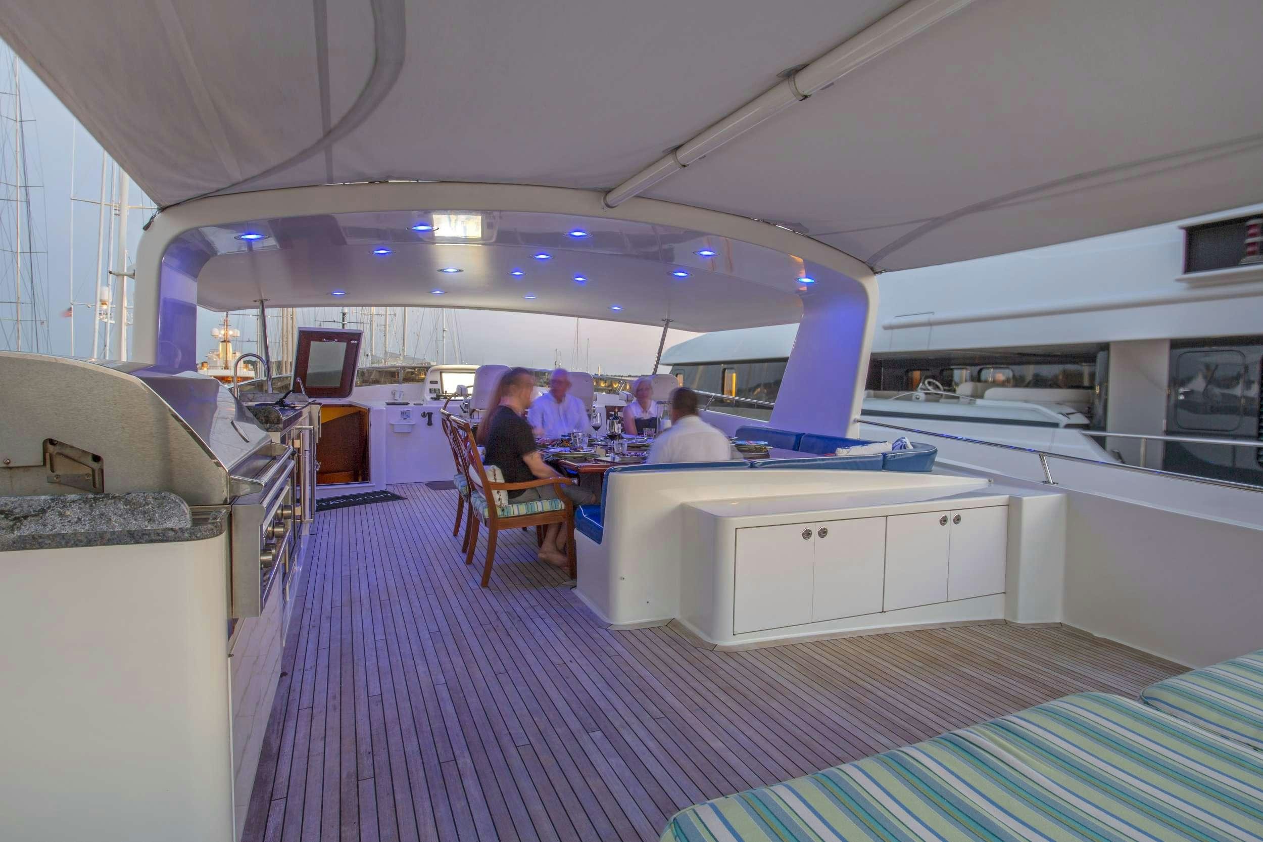 people sitting at a table aboard STARLIGHT Yacht for Charter