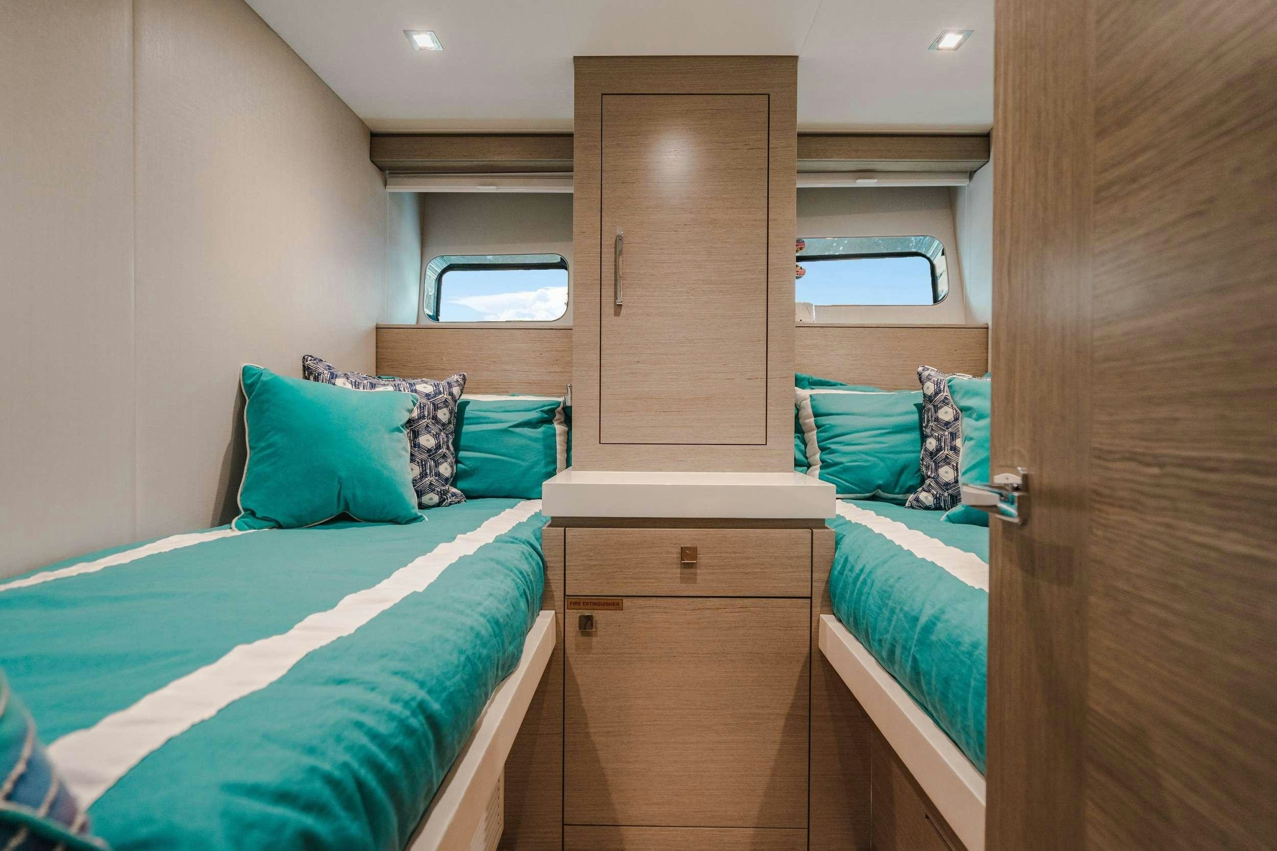 a couple of beds in a room aboard BELLA SKY Yacht for Charter