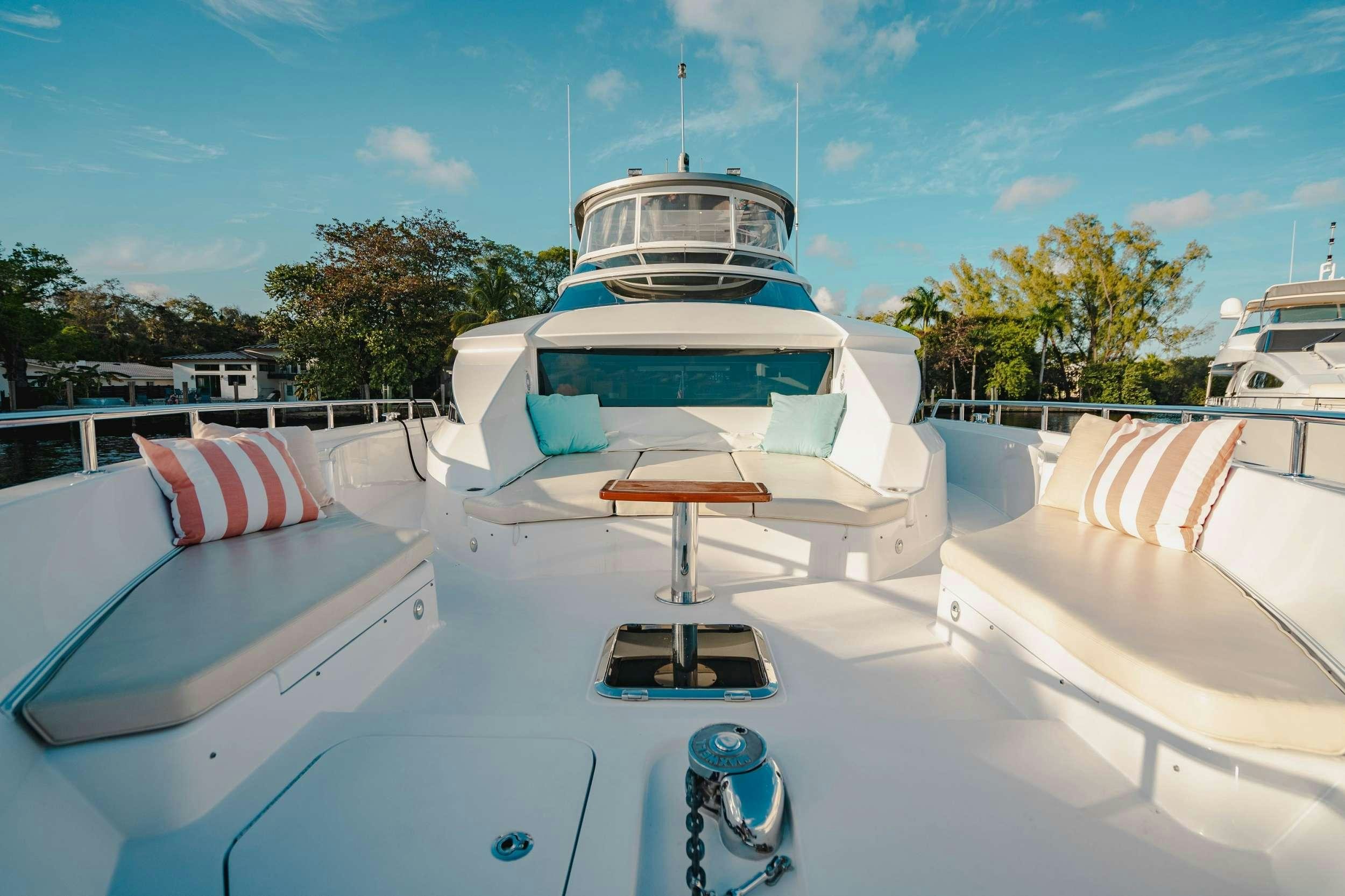 a boat docked at a pier aboard BELLA SKY Yacht for Charter