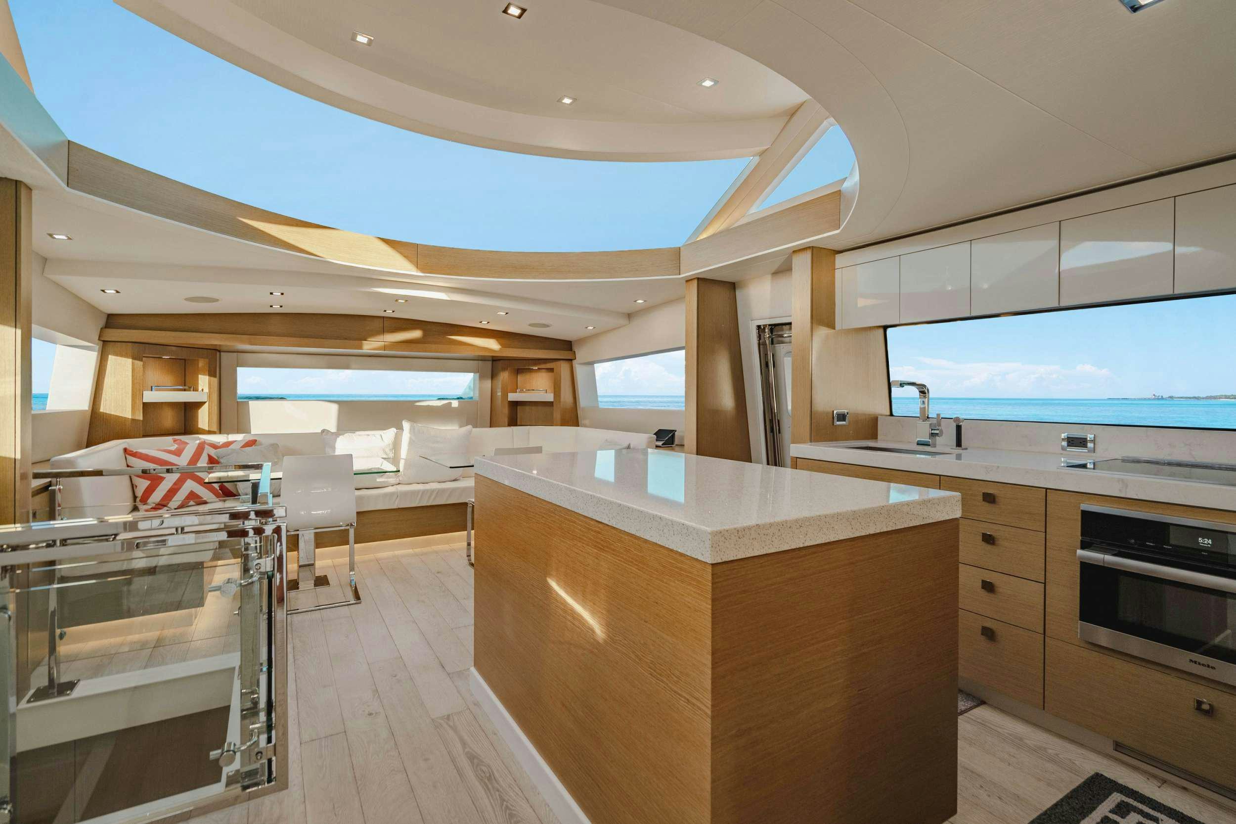 a large kitchen with a large island aboard BELLA SKY Yacht for Charter