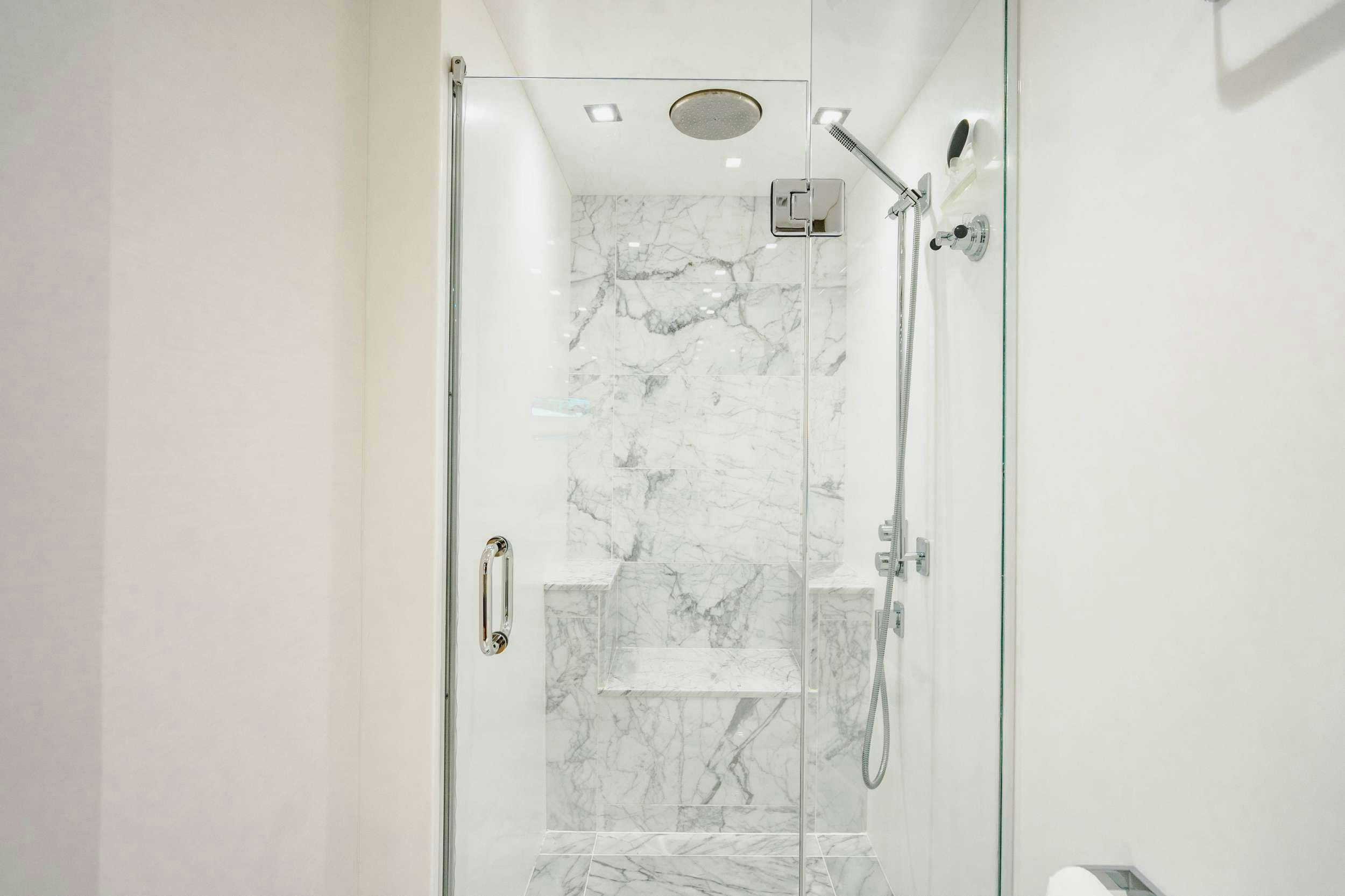a shower with a glass door aboard BELLA SKY Yacht for Charter