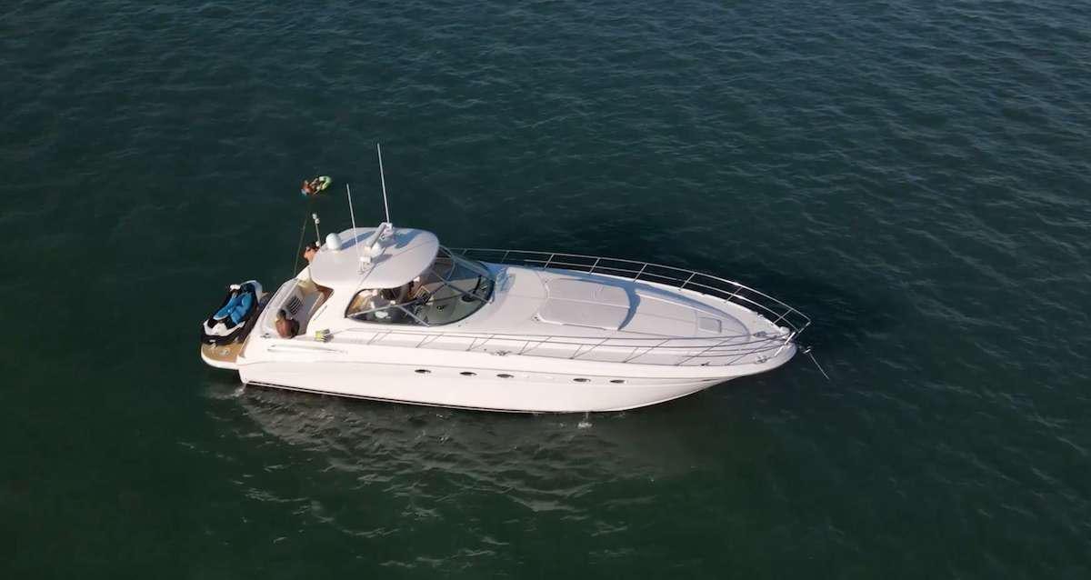 a white boat in the water aboard Low Profile Yacht for Charter