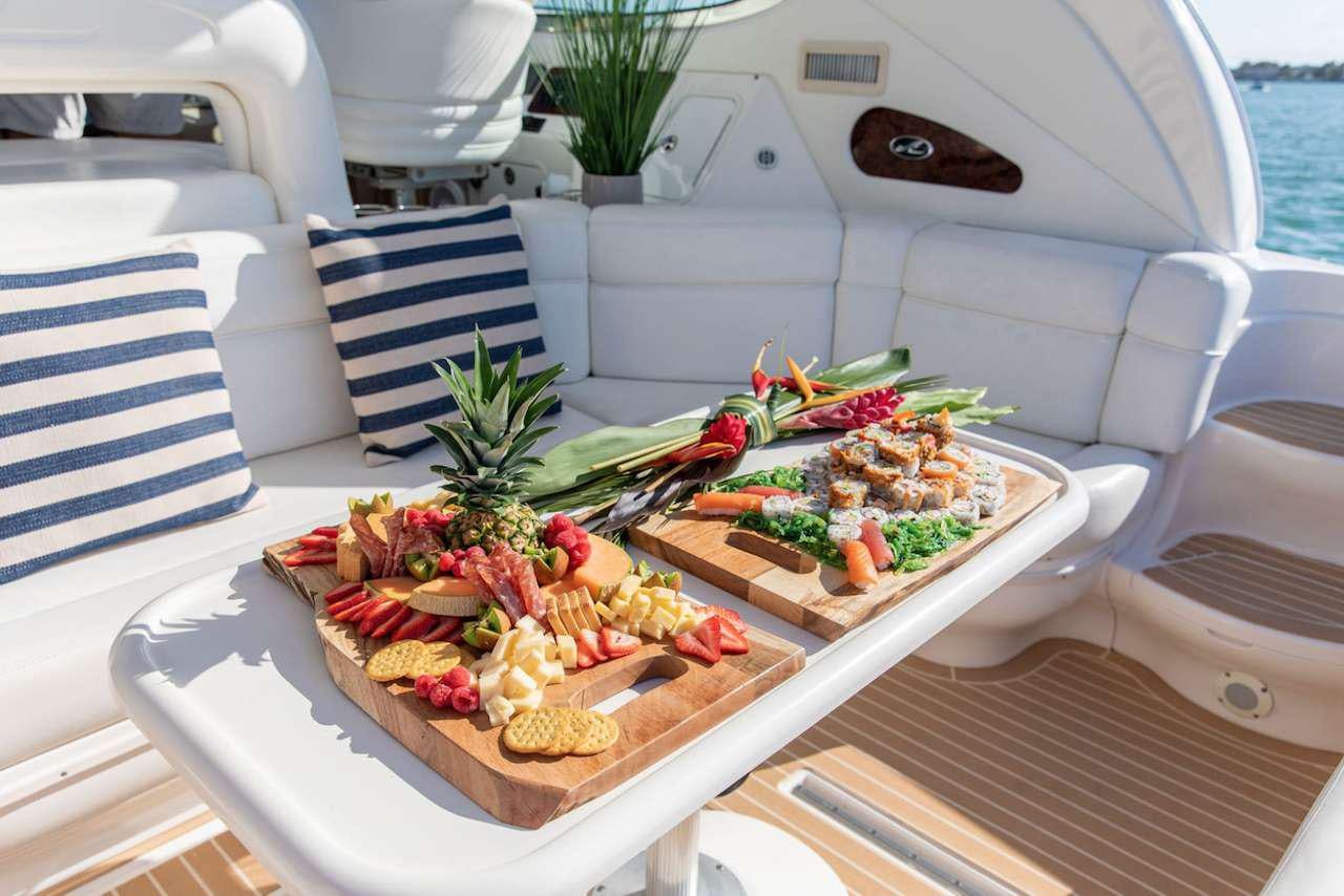 a tray of food on a boat aboard Low Profile Yacht for Charter