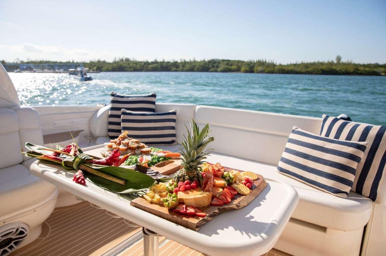 a table with food on it aboard Low Profile Yacht for Charter