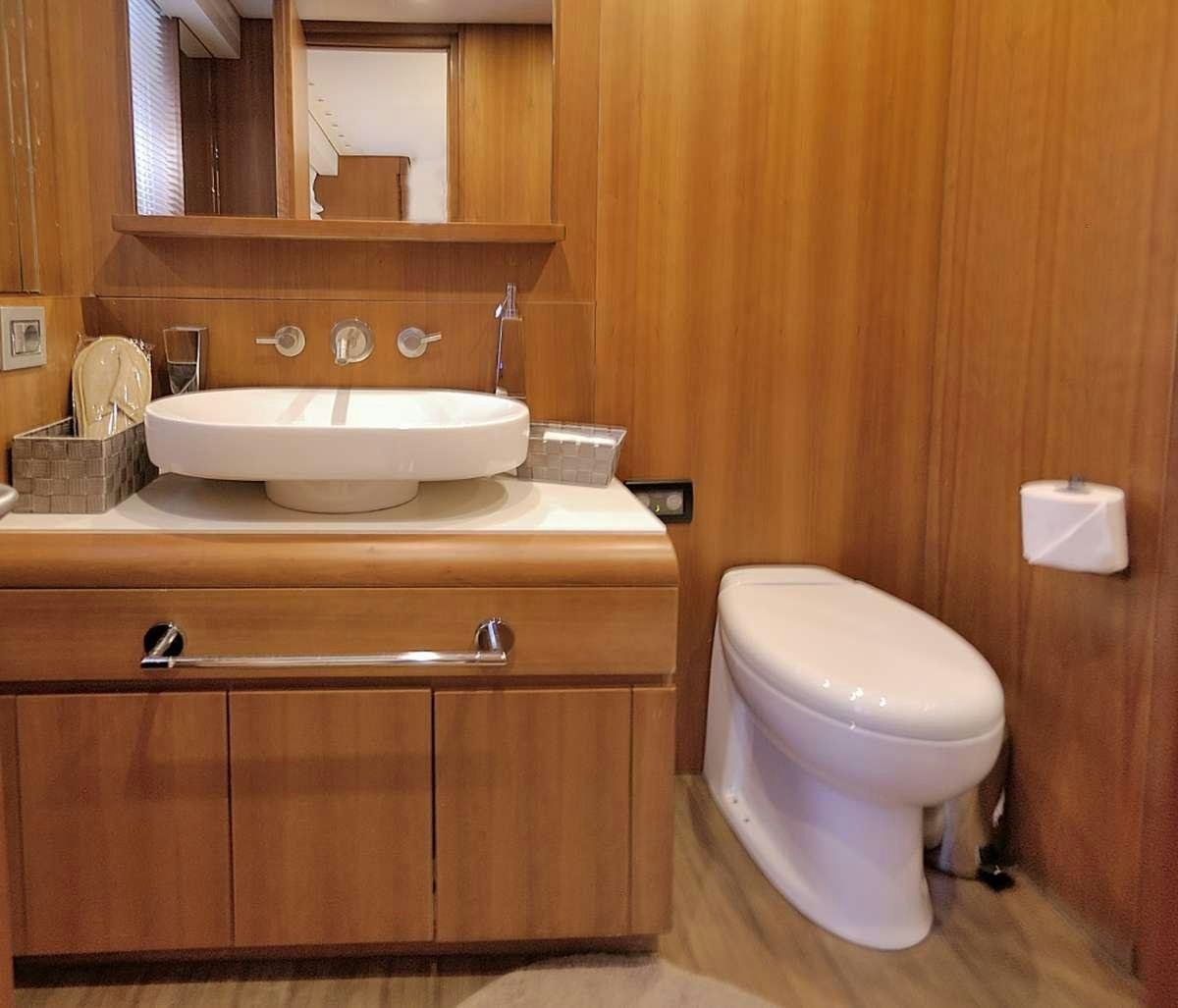 a bathroom with a toilet and sink aboard FUNSEA Yacht for Charter