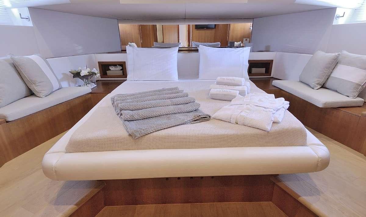 a bed with white pillows aboard FUNSEA Yacht for Charter