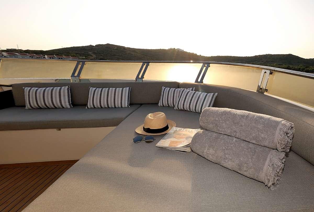 a couch and a table on a boat aboard FUNSEA Yacht for Charter