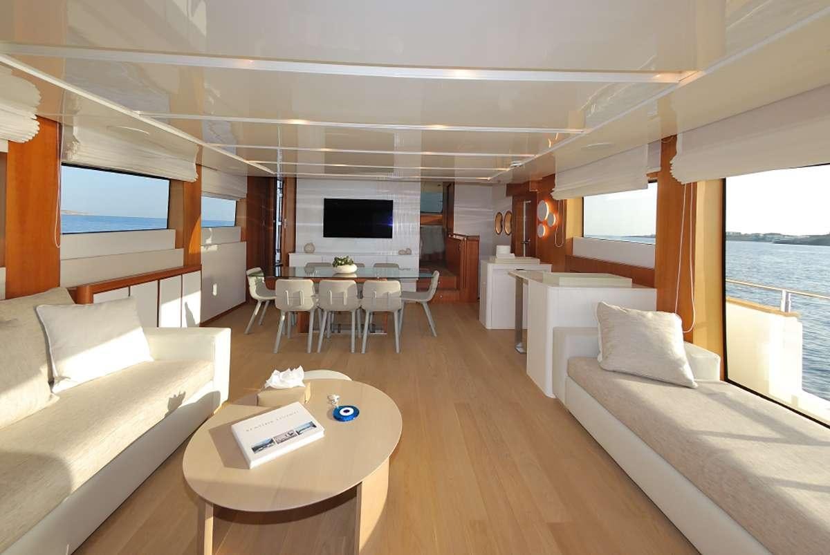 a living room with a couch and a table aboard FUNSEA Yacht for Charter