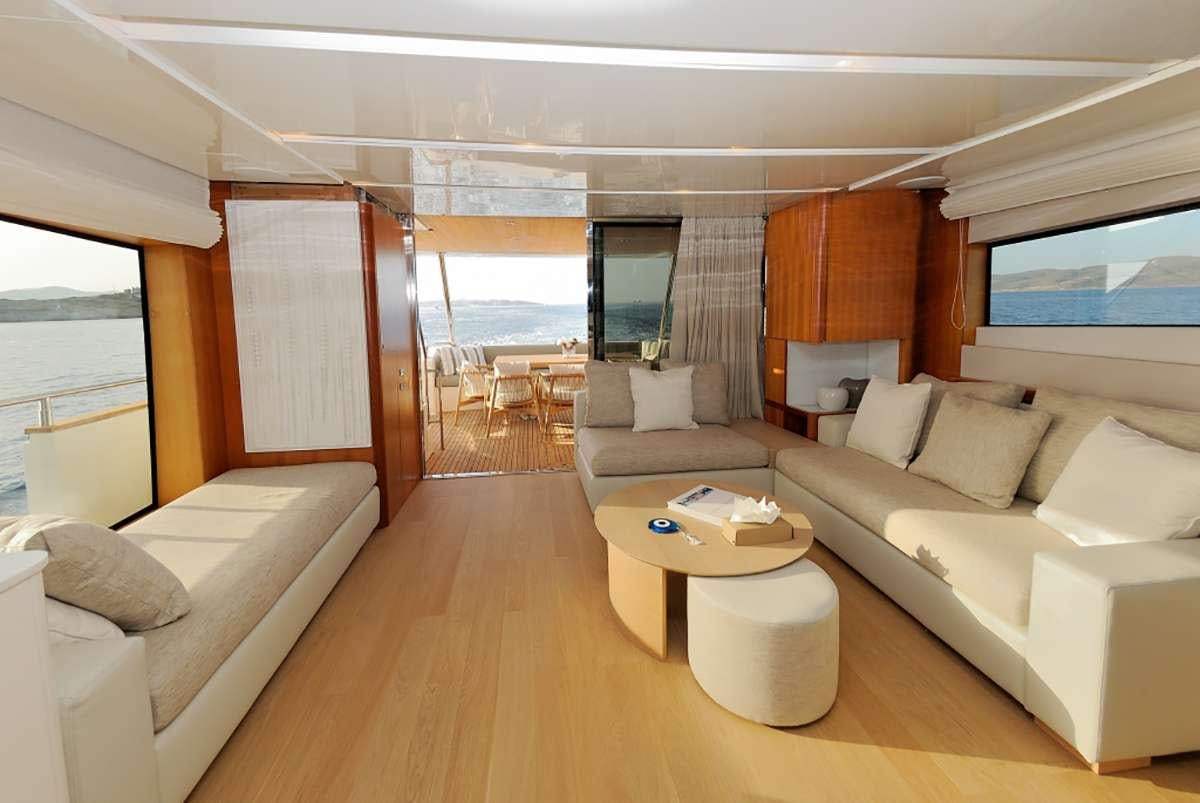 a living room with a large window aboard FUNSEA Yacht for Charter