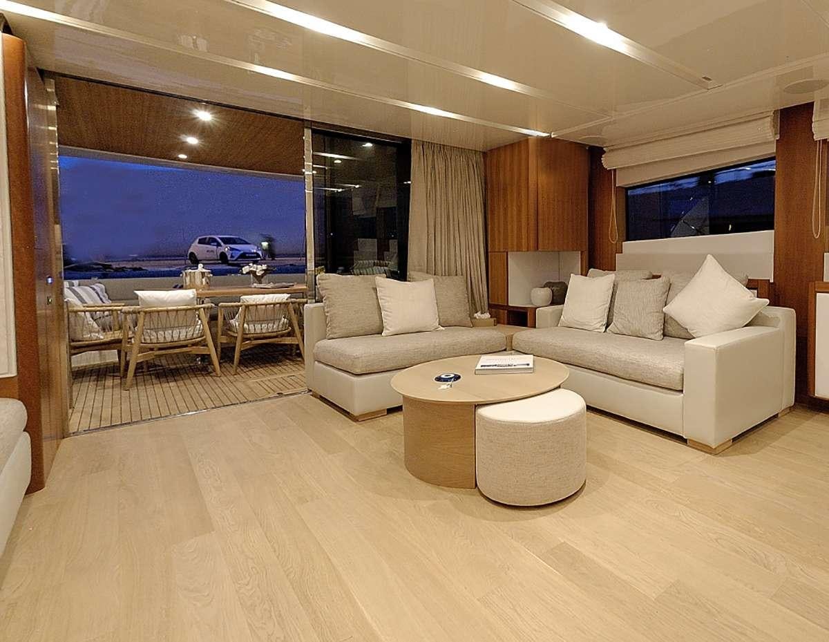 a living room with a large screen aboard FUNSEA Yacht for Charter