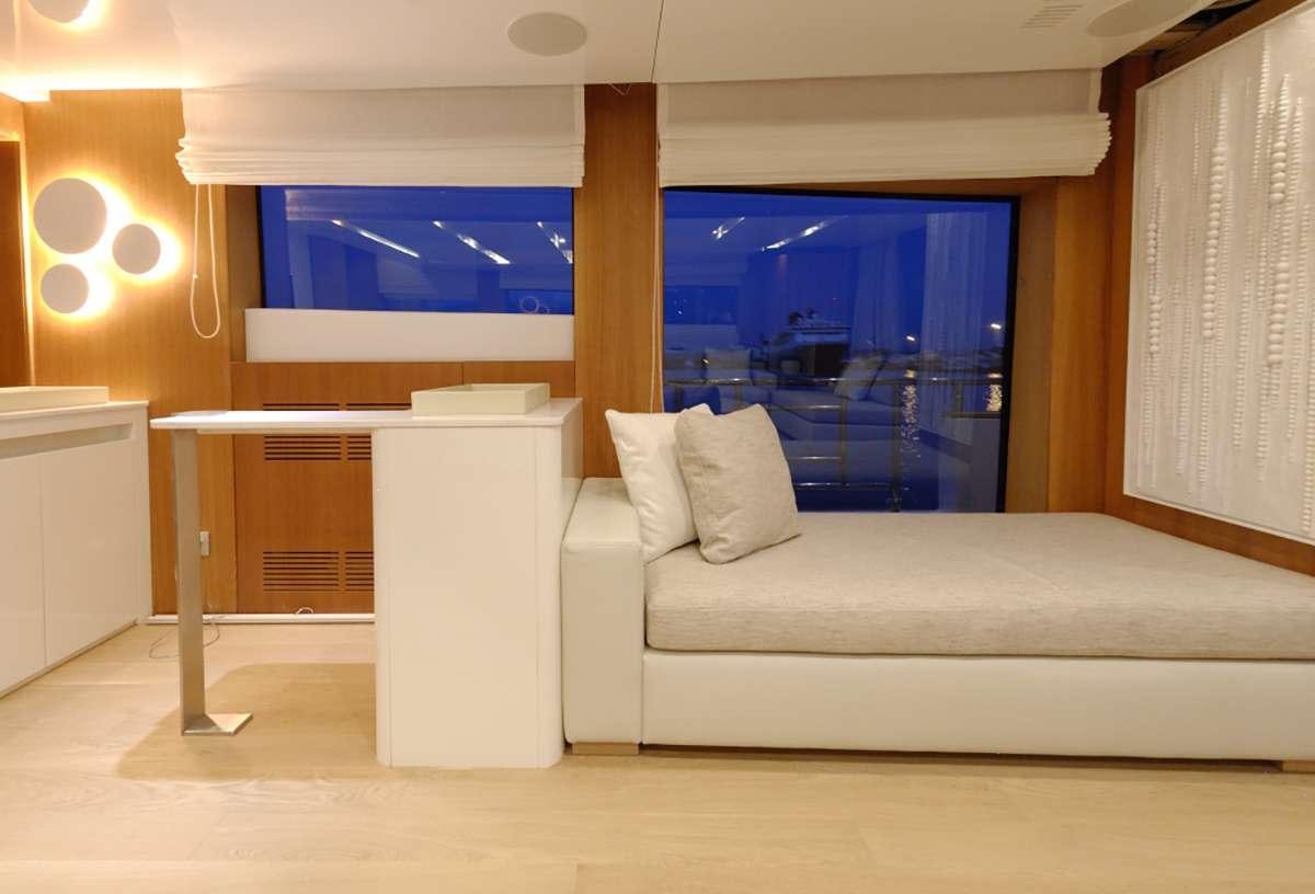 a white couch in a room aboard FUNSEA Yacht for Charter