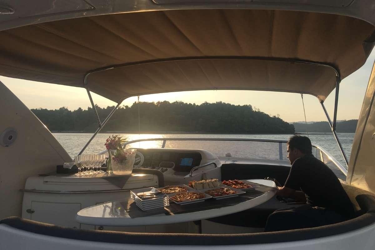 a person sitting in a boat aboard 137 PILLARS SPIRIT Yacht for Charter