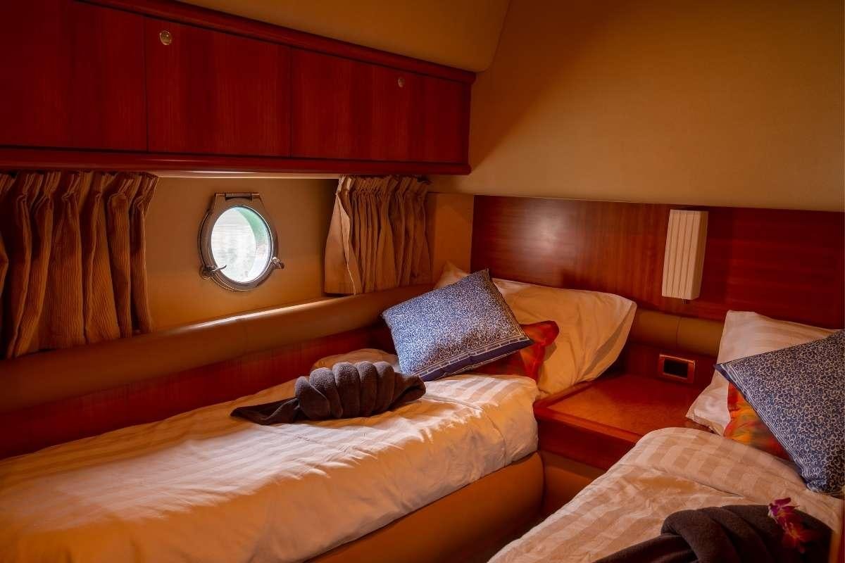 a couple of beds in a hotel room aboard 137 PILLARS SPIRIT Yacht for Charter