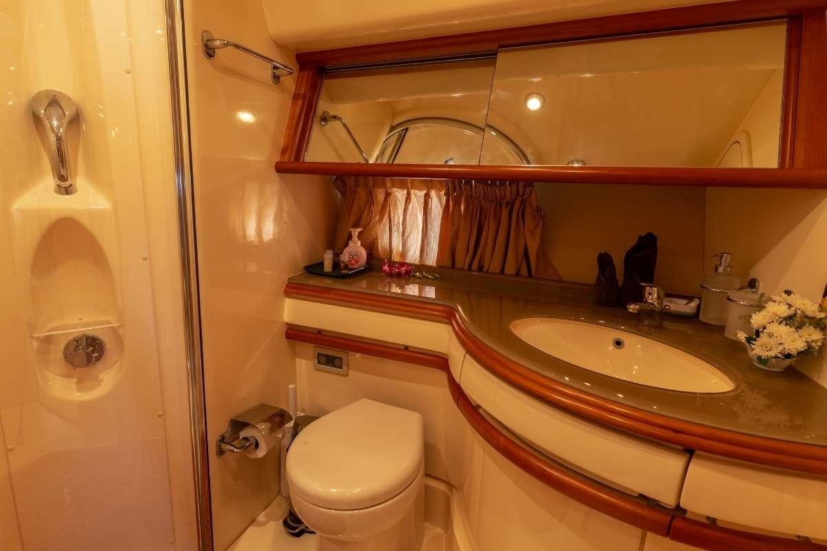 a bathroom with a sink and a toilet aboard 137 PILLARS SPIRIT Yacht for Charter
