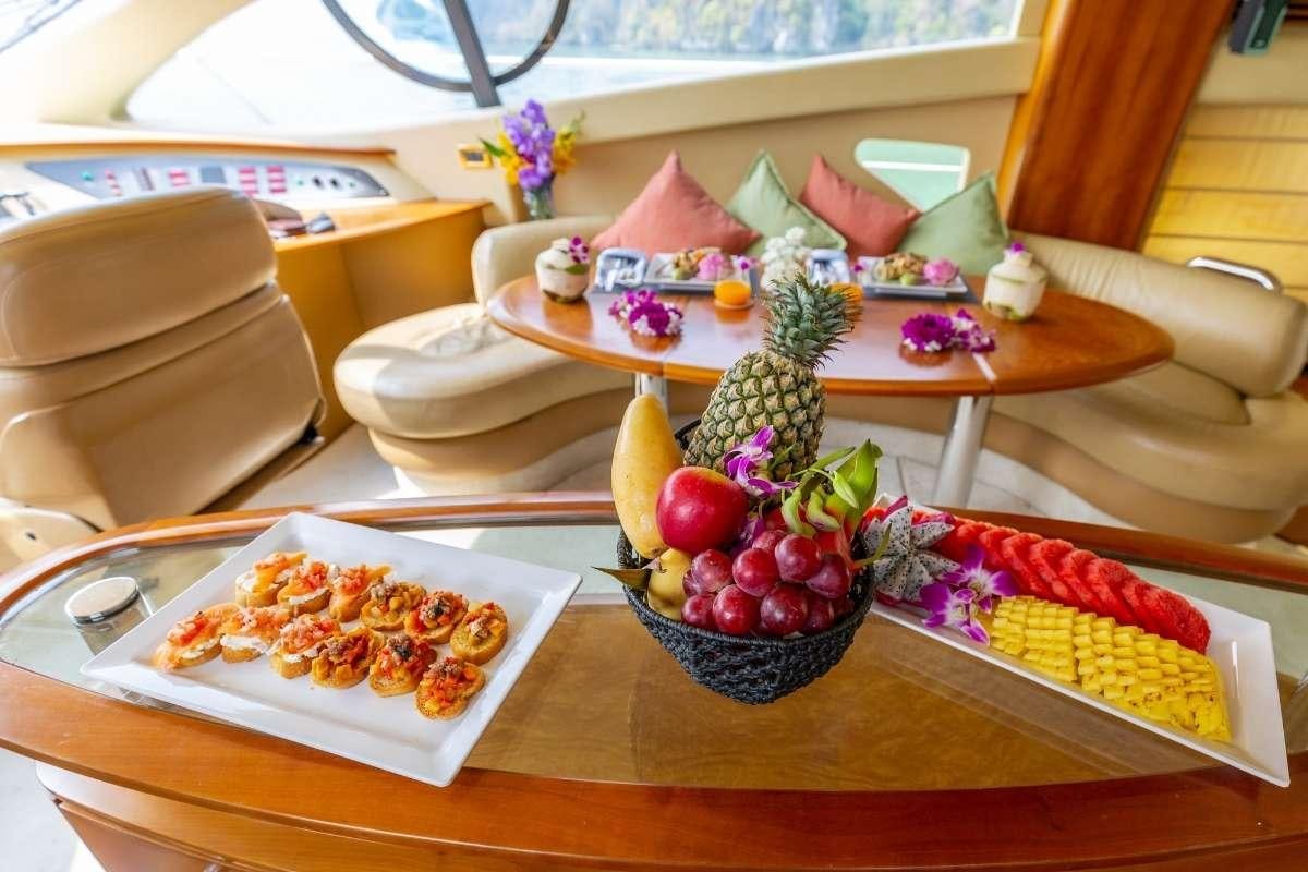 a table with food on it aboard 137 PILLARS SPIRIT Yacht for Charter