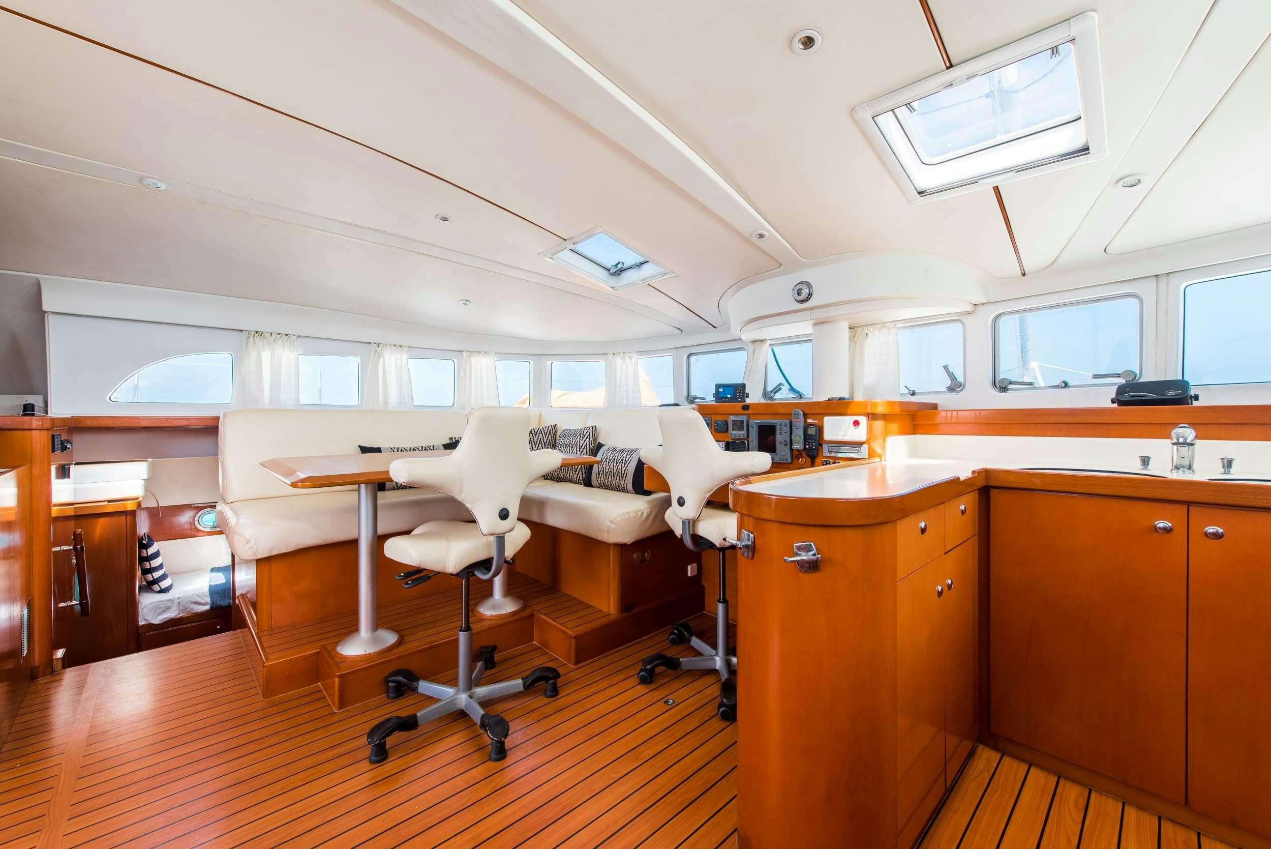 an office with a desk and chairs aboard JOVA Yacht for Charter