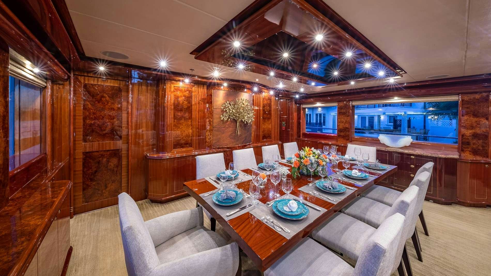 a dining room with a table and chairs aboard LADY LEILA Yacht for Charter