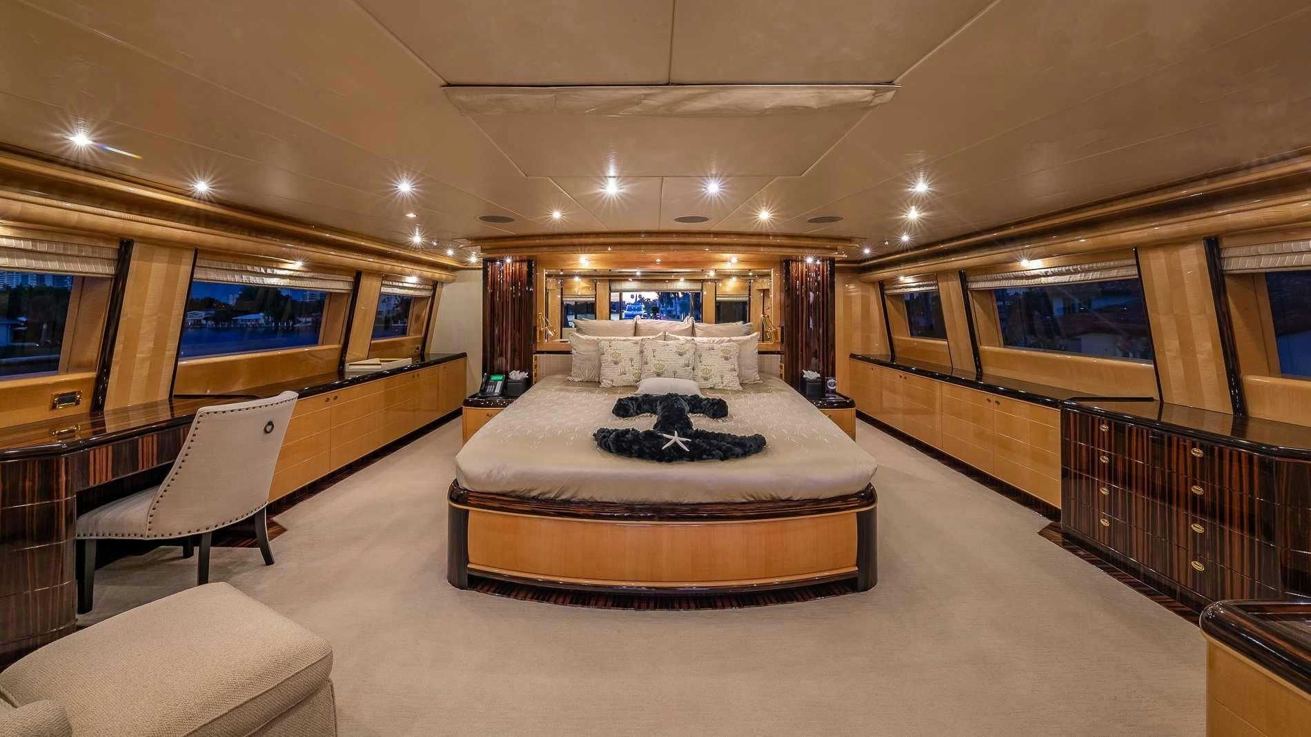 a large hotel room with a large bed and a large window aboard LADY LEILA Yacht for Charter
