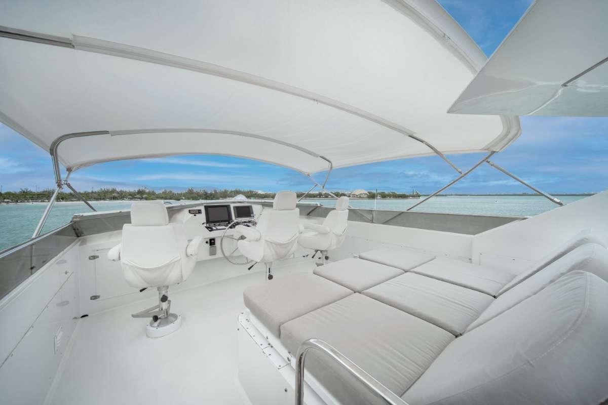a white tent with white chairs on it aboard OCEAN DRIVE Yacht for Charter