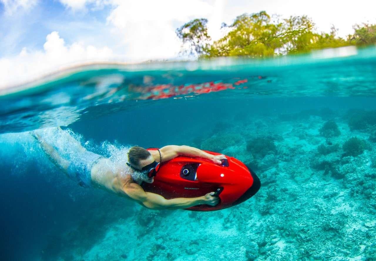 a person in a go-kart on a body of water aboard MERIDIAN ADVENTURE Yacht for Charter