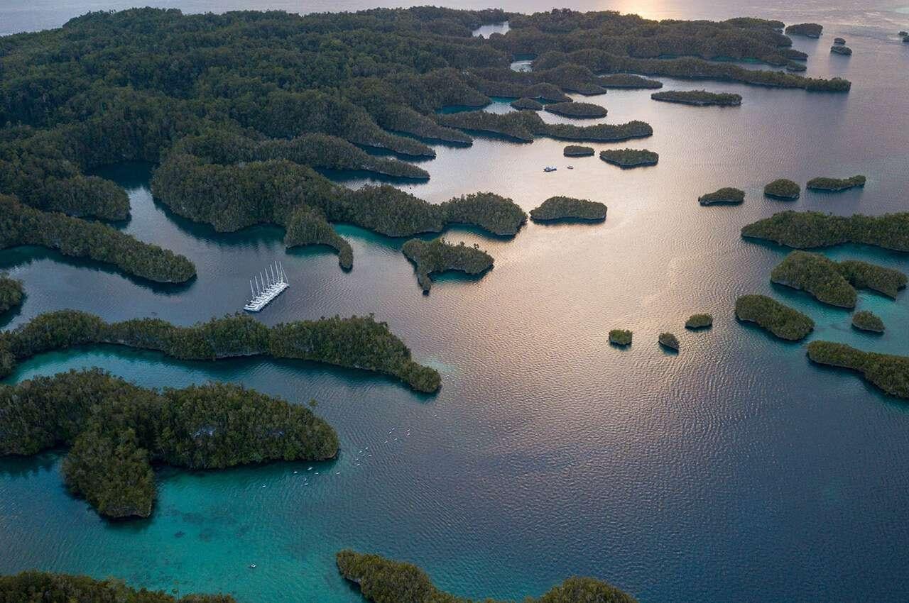 a body of water with islands aboard MERIDIAN ADVENTURE - RAJA AMPAT Yacht for Charter