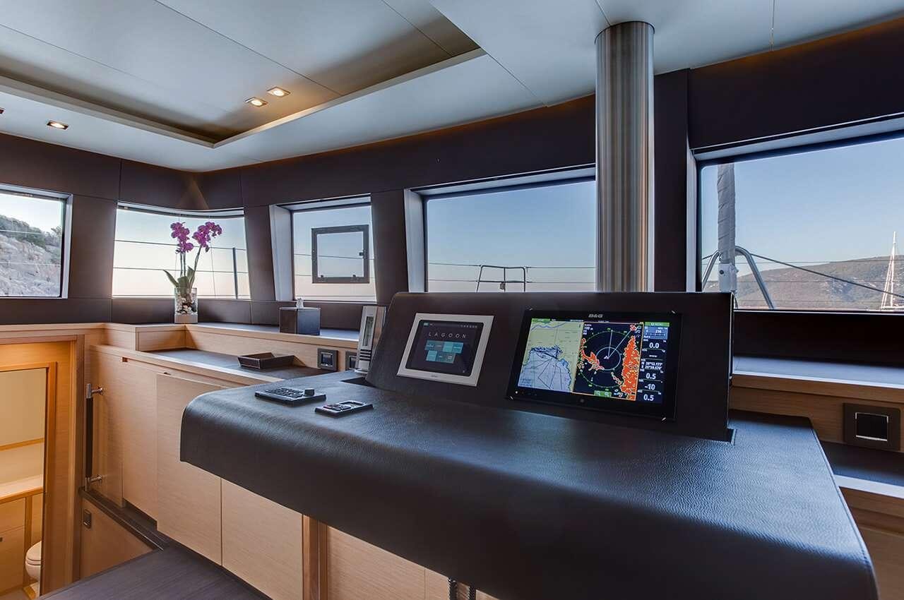 a room with a desk and a computer aboard MERIDIAN ADVENTURE - RAJA AMPAT Yacht for Charter