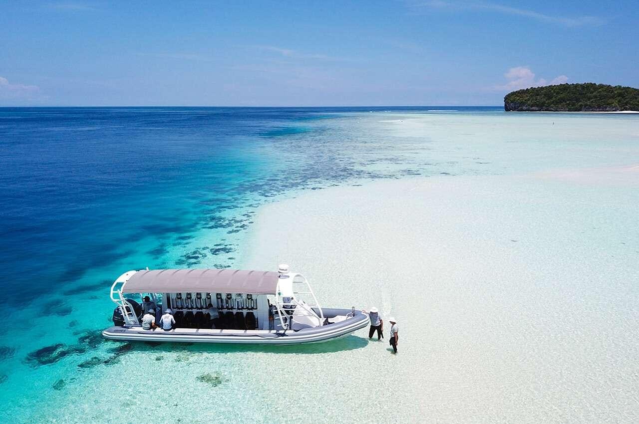 a boat in the water aboard MERIDIAN ADVENTURE - RAJA AMPAT Yacht for Charter