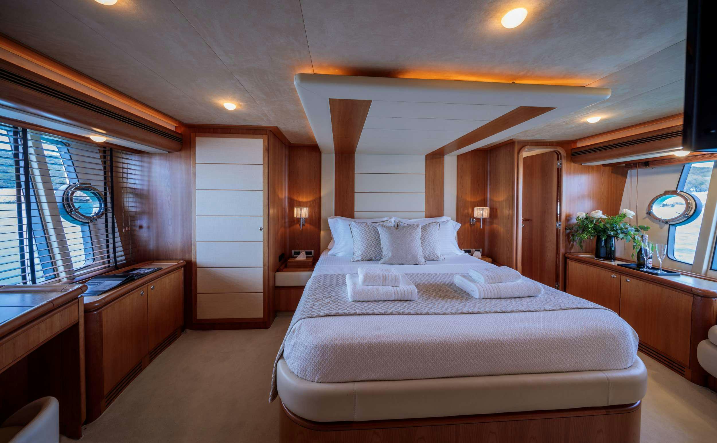 a bedroom with a large bed aboard MY WAY Yacht for Charter