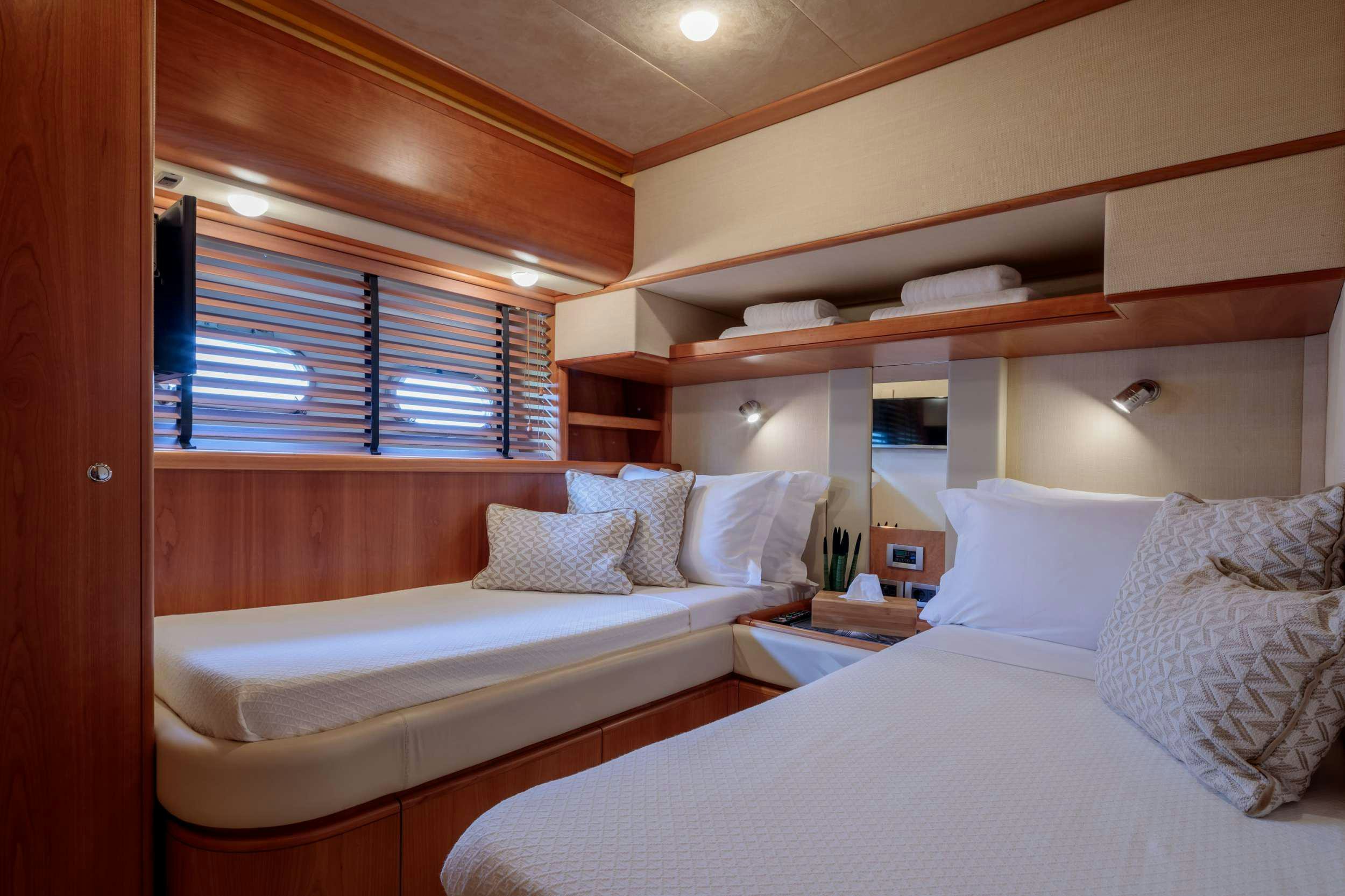 a couple of beds in a room aboard MY WAY Yacht for Charter