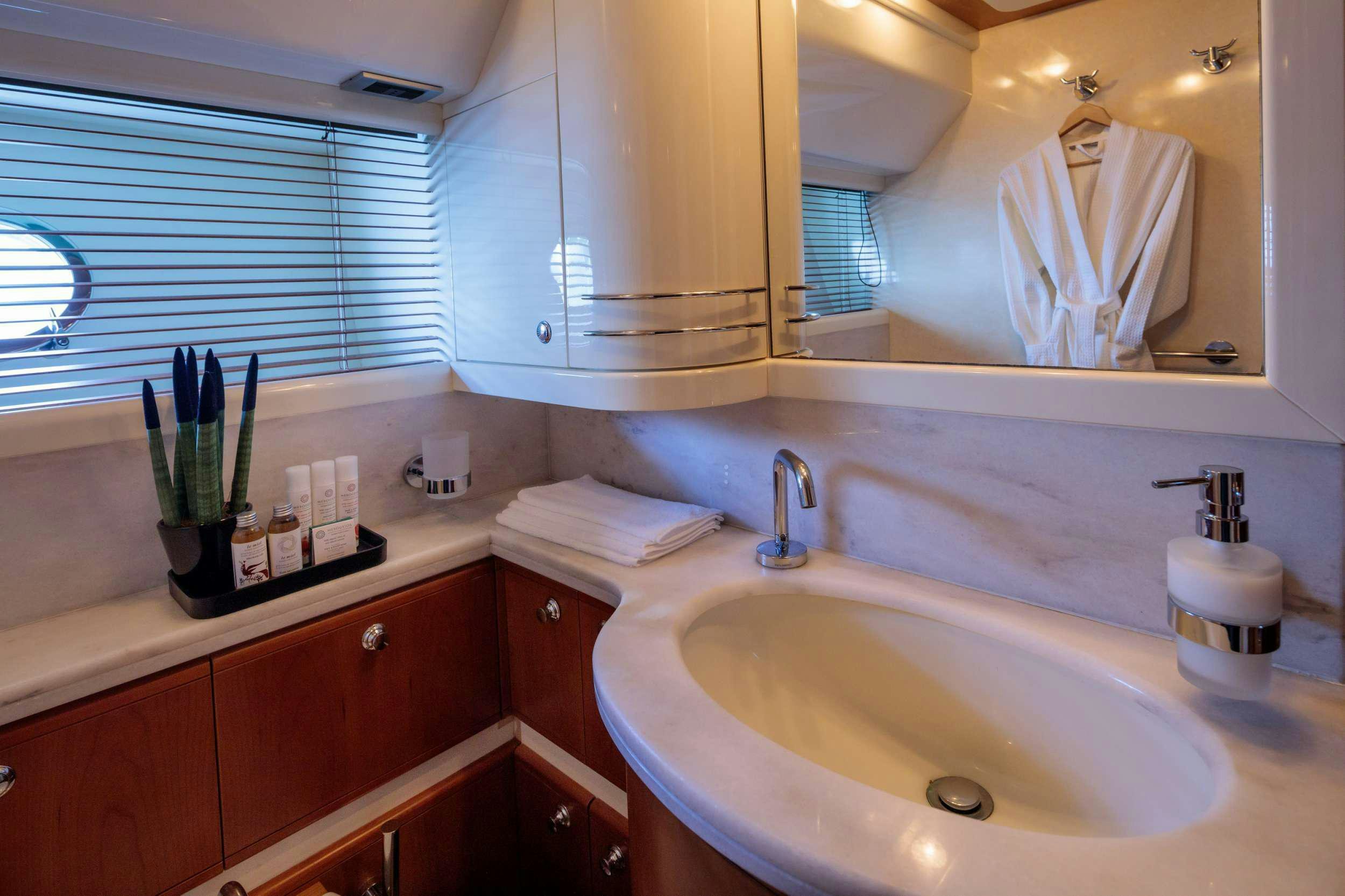 a bathroom with a sink and a mirror aboard MY WAY Yacht for Charter