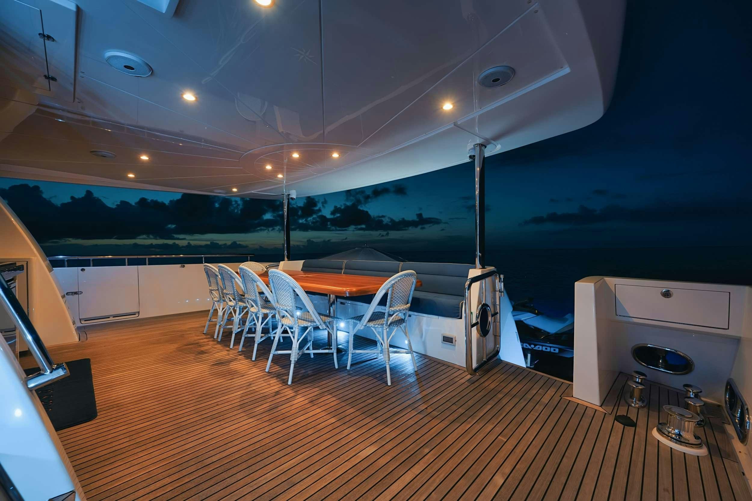 a room with a table and chairs aboard SHE'S A PEACH Yacht for Charter