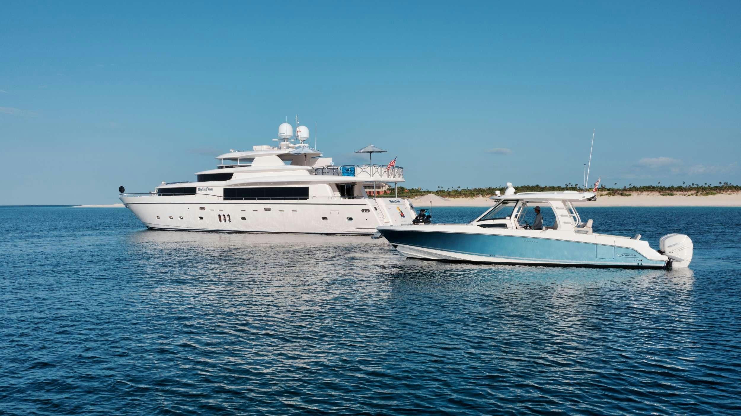 a couple of white boats in the water aboard SHE'S A PEACH Yacht for Charter