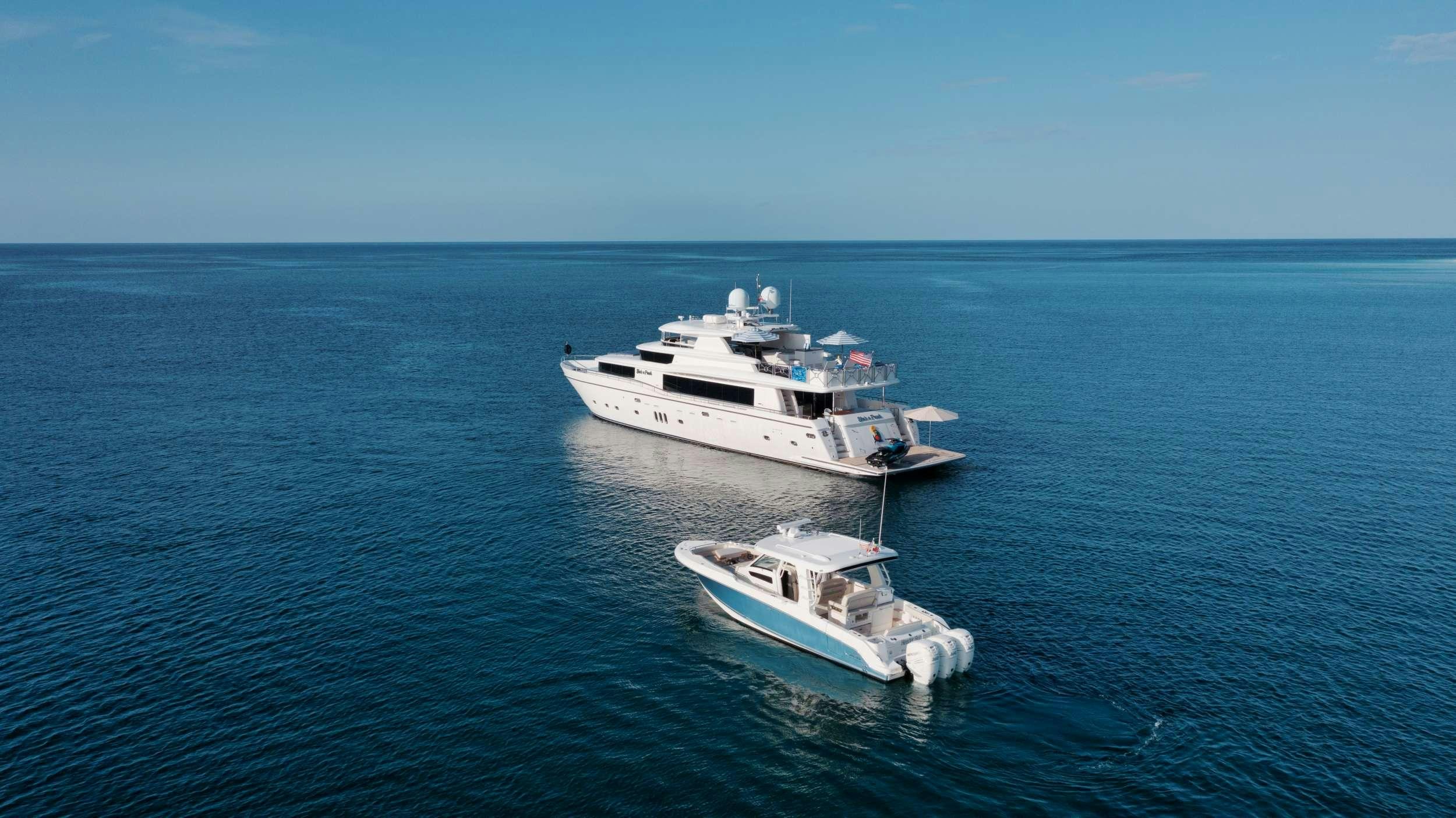 a couple of boats in the water aboard SHE'S A PEACH Yacht for Charter