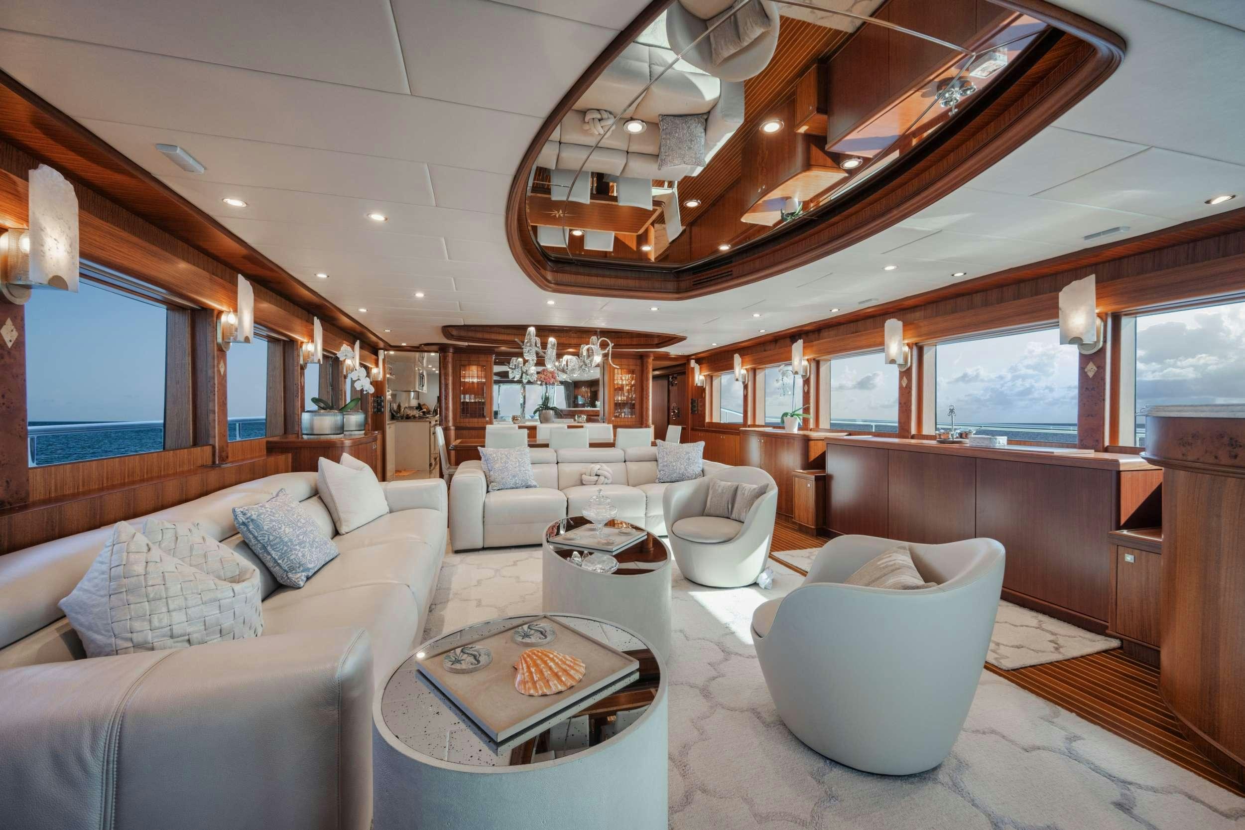 a living room with a large open window aboard SHE'S A PEACH Yacht for Charter