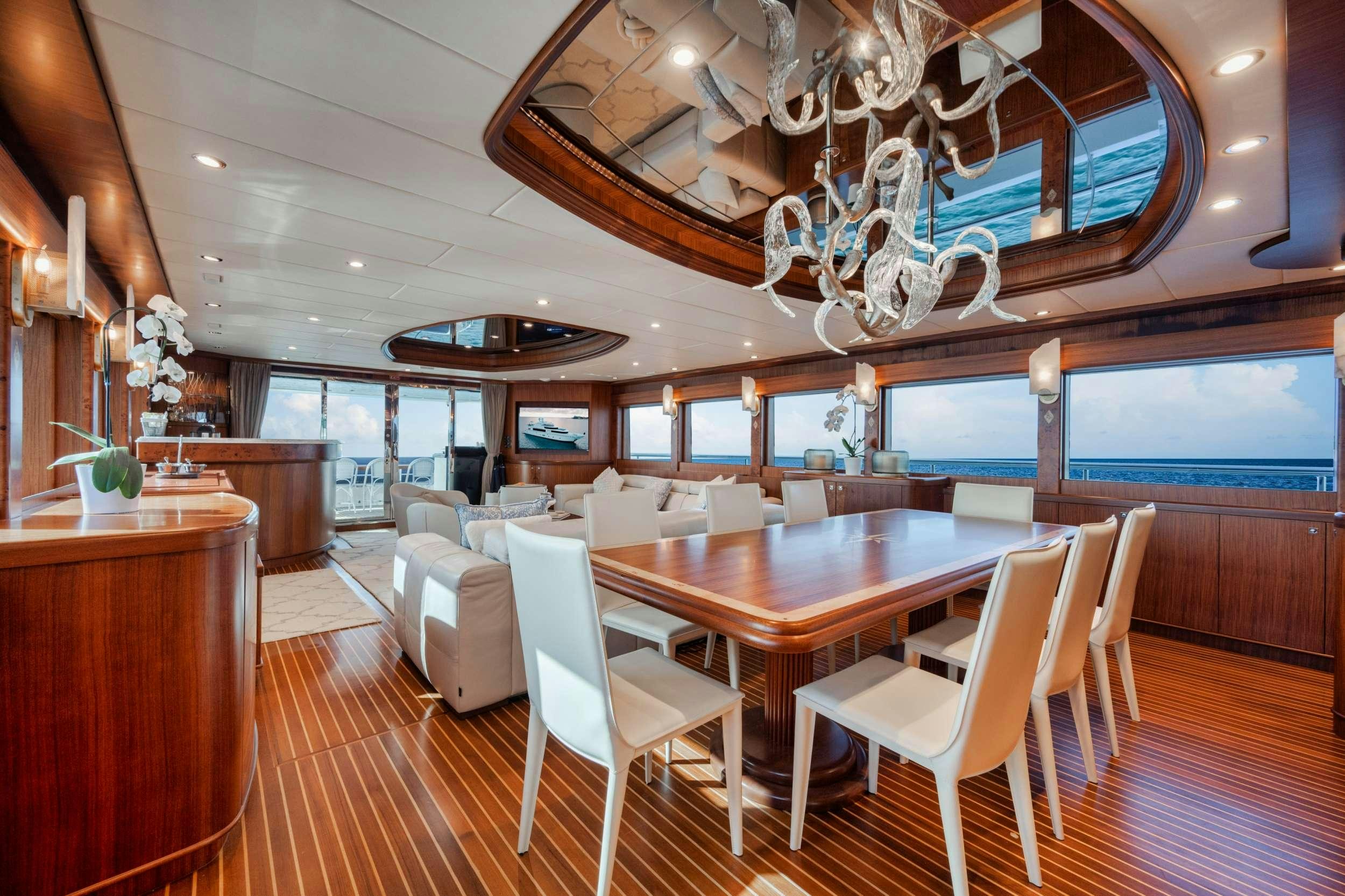 a large room with a table and chairs aboard SHE'S A PEACH Yacht for Charter
