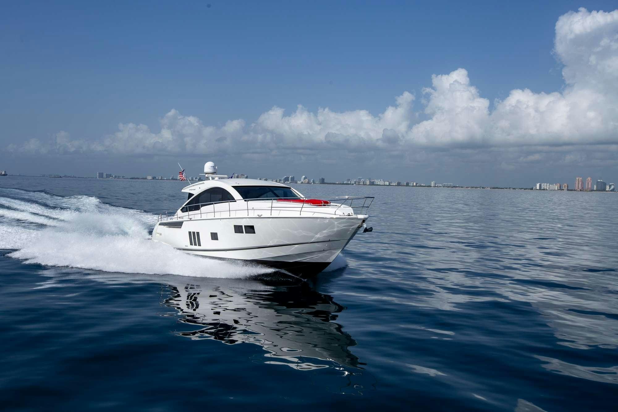a white boat on the water aboard MY GIRL Yacht for Charter