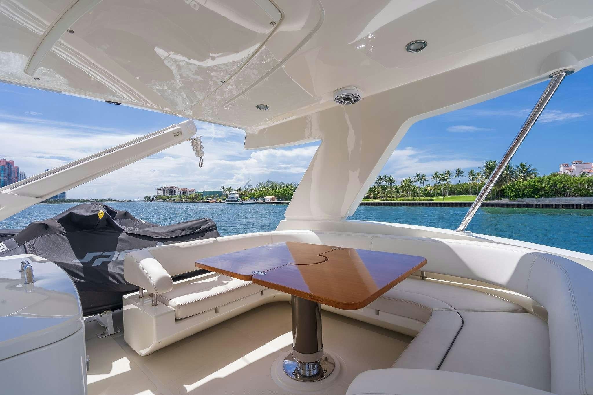 a pool with a table and chairs aboard M3 Yacht for Charter