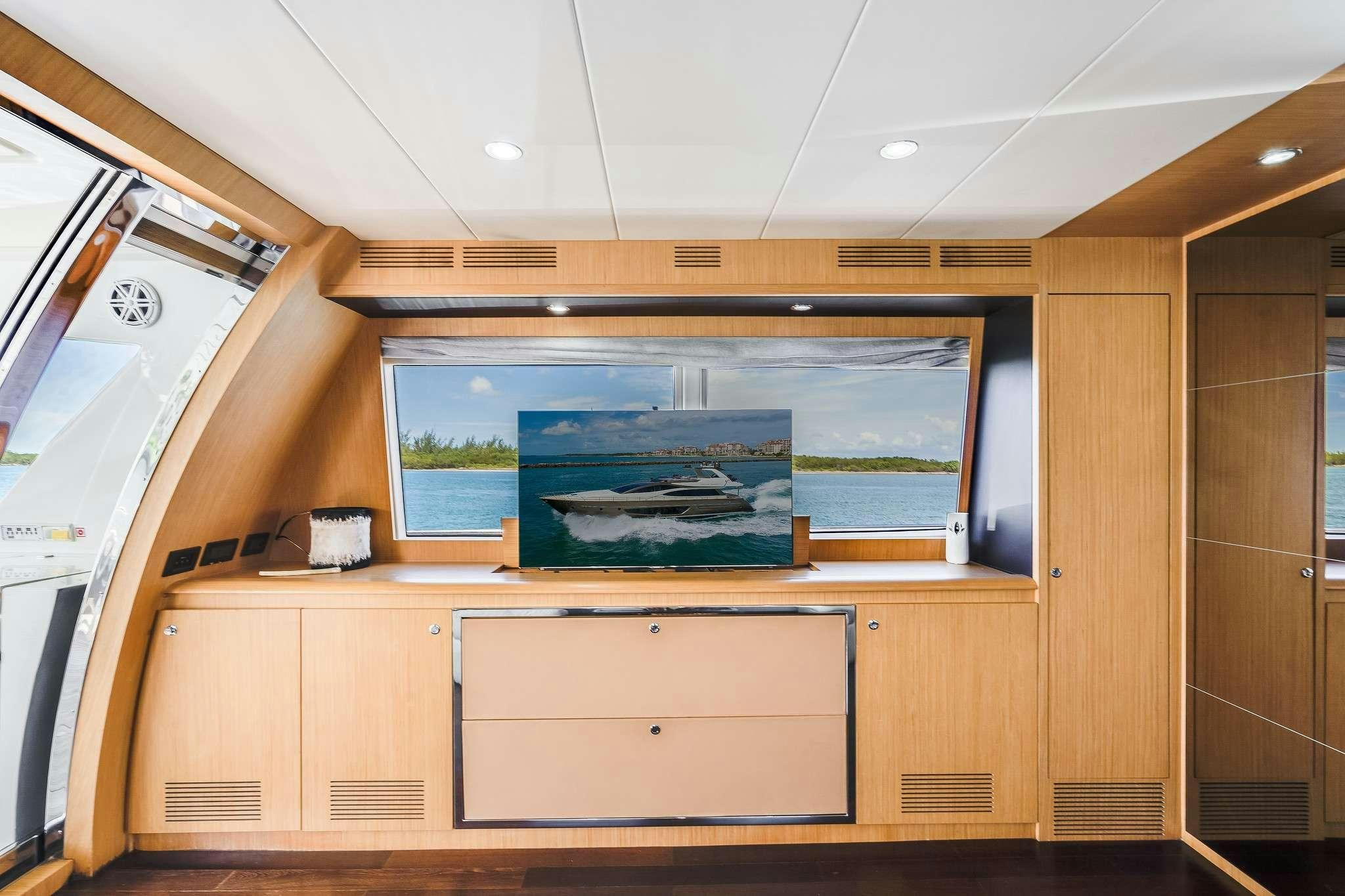 a room with a desk and a window aboard M3 Yacht for Charter