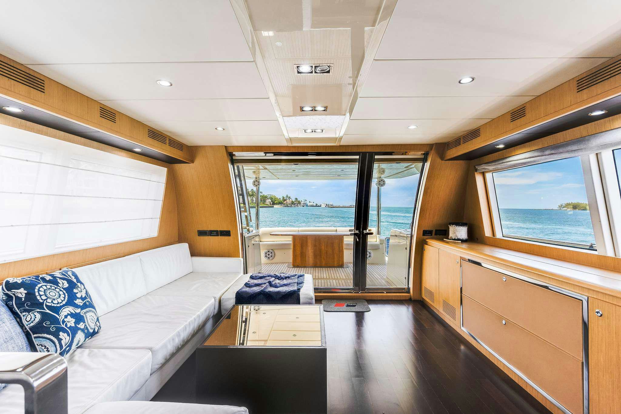 a room with a bed and a large window aboard M3 Yacht for Charter