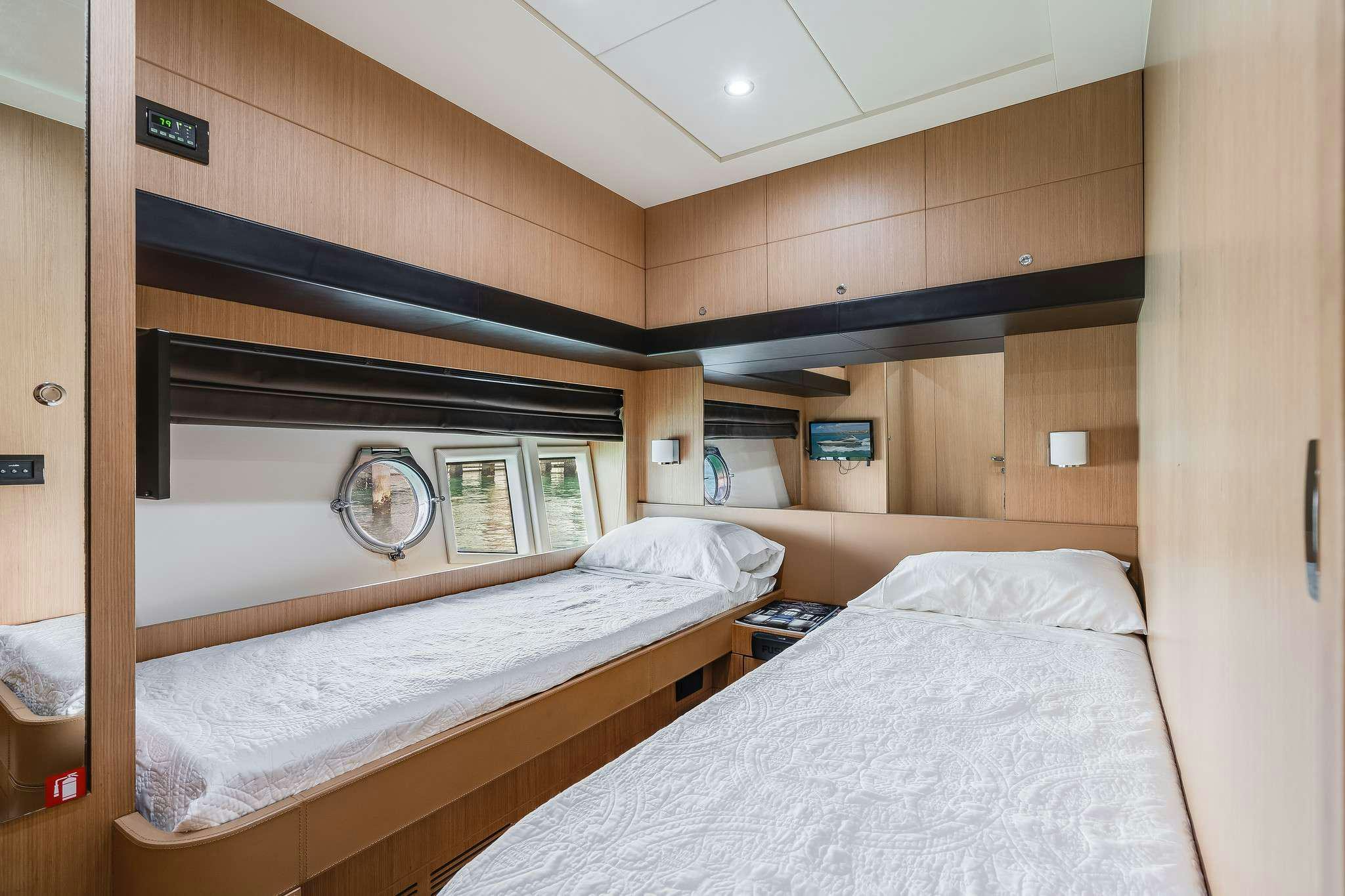 a room with two beds aboard M3 Yacht for Charter