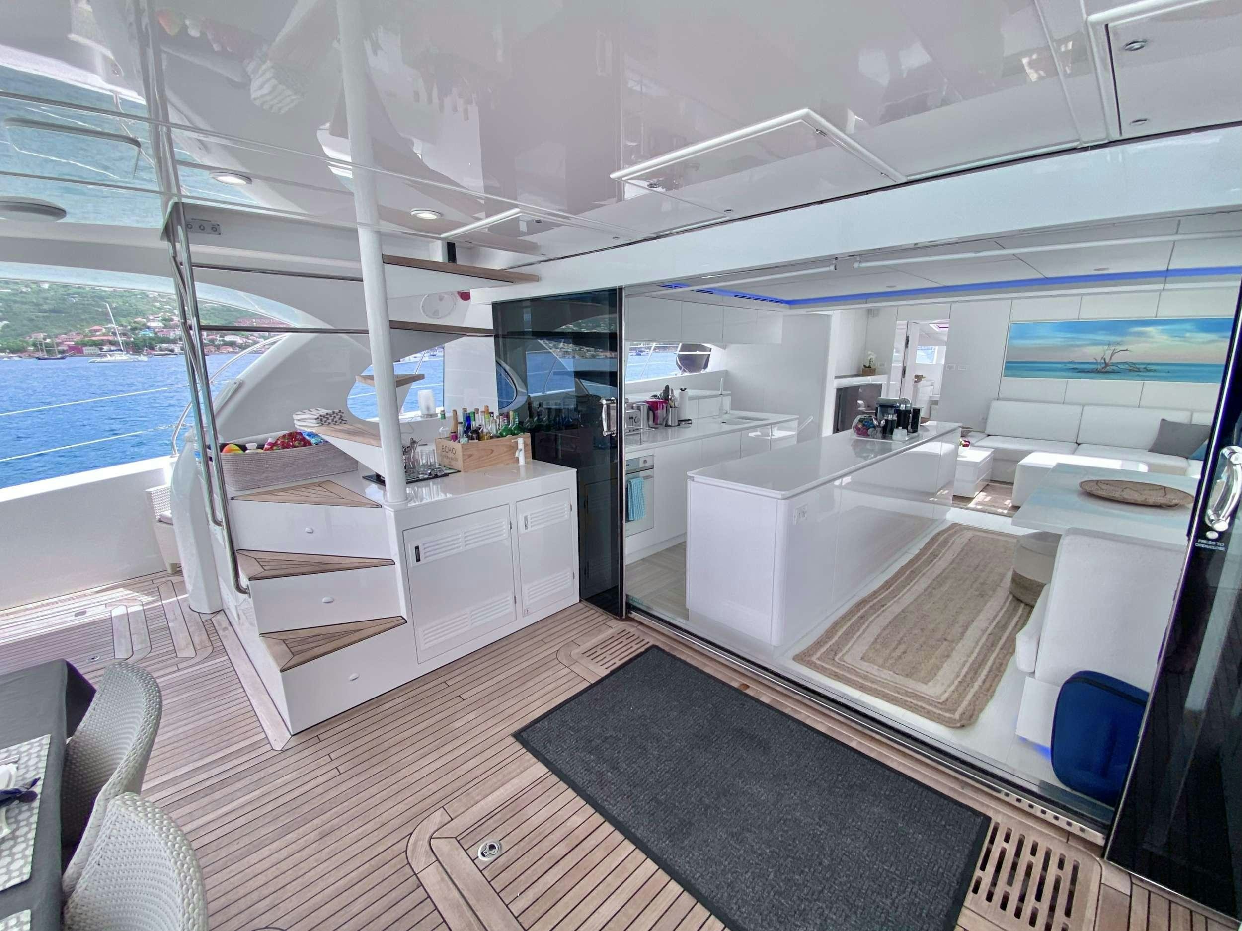 a room with a large window and a wood floor aboard ROYAL RITA Yacht for Charter