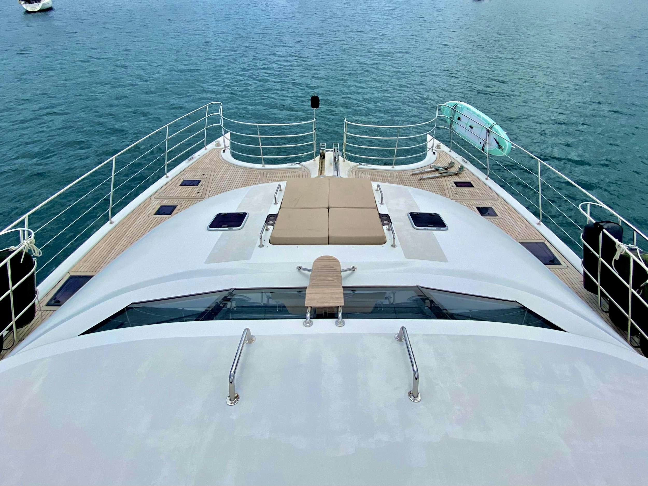 a white boat on the water aboard ROYAL RITA Yacht for Charter