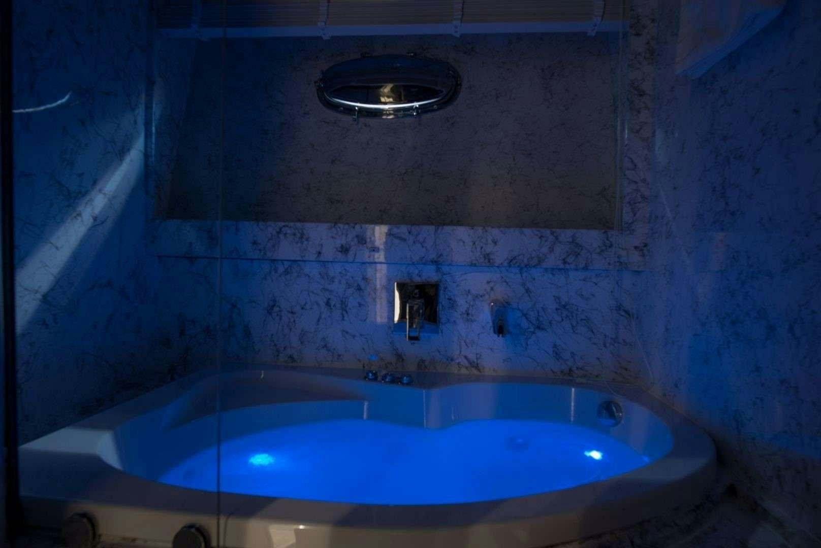 a bathtub with a sink aboard ANDROMEDA Yacht for Charter