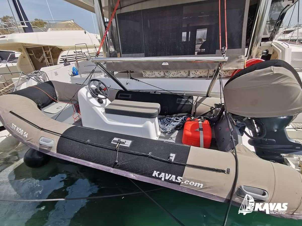 a boat with a helmet on the deck aboard Kos 54.Cat (Athens) Yacht for Charter