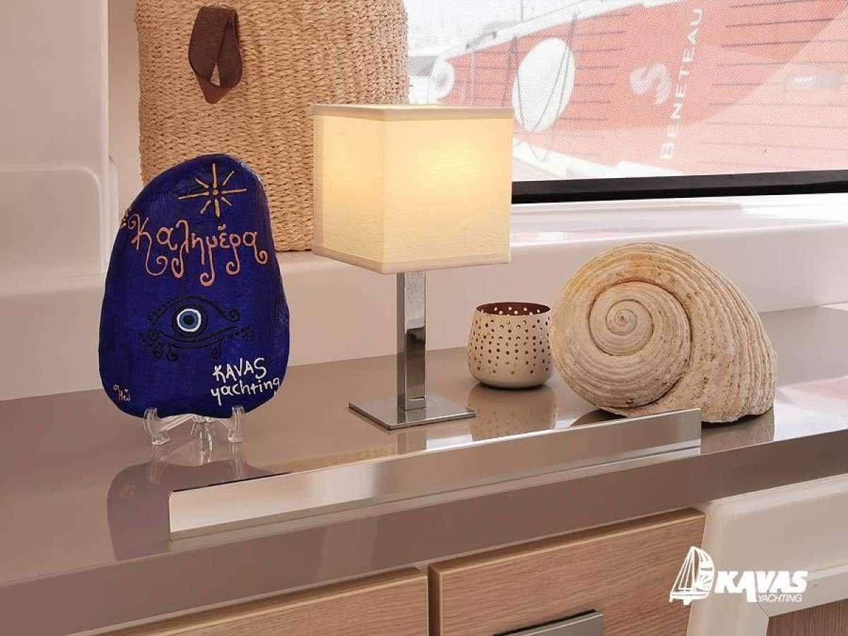 a shelf with a lamp and a mirror aboard Kos 54.Cat (Athens) Yacht for Charter