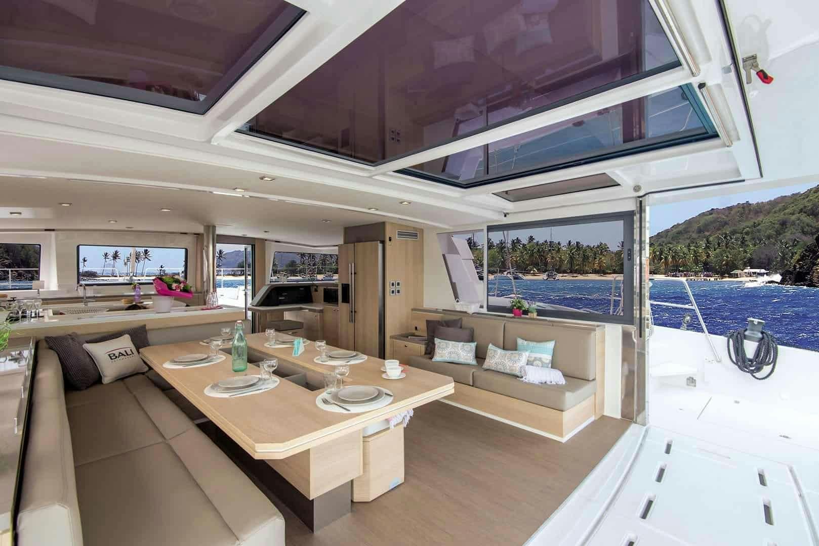 a room with a table and chairs aboard Kos 54.Cat (Athens) Yacht for Charter